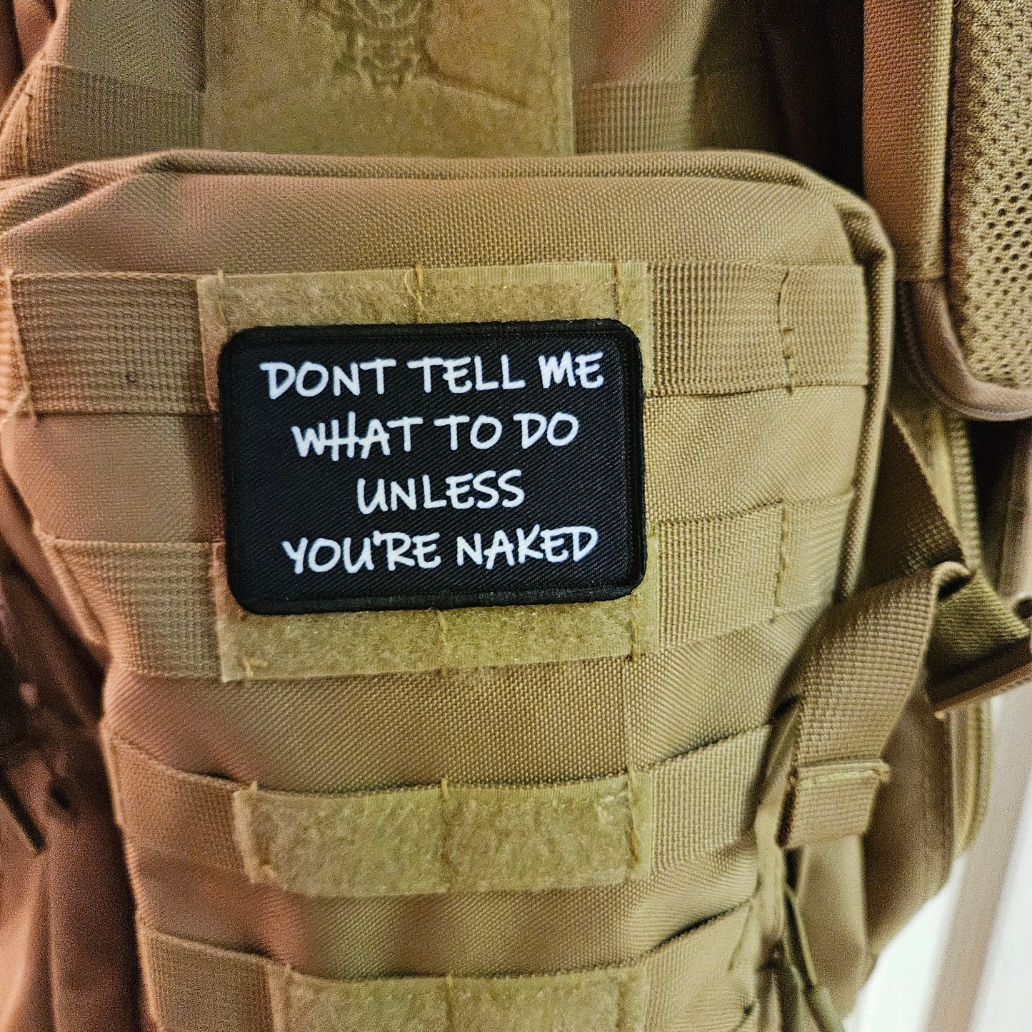 Don't tell me what to do unless you're naked 2"x3" morale patch with hook and loop backing
