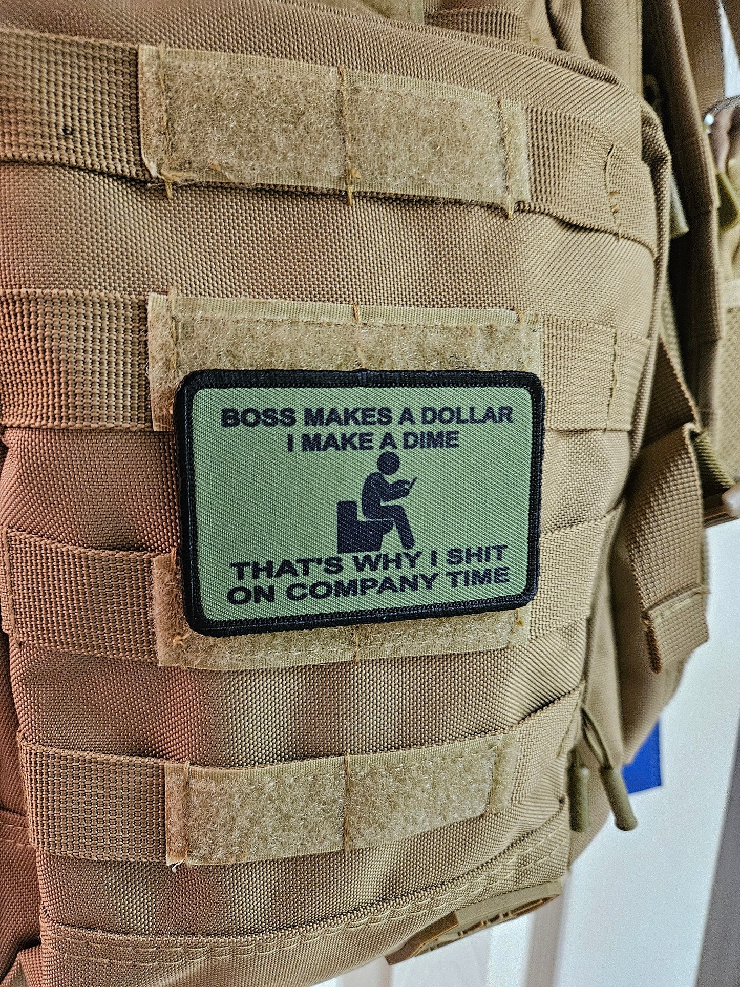 Boss makes a dollar I make a dime that's why I shit on company time 2"x3" morale patch with hook and loop backing green