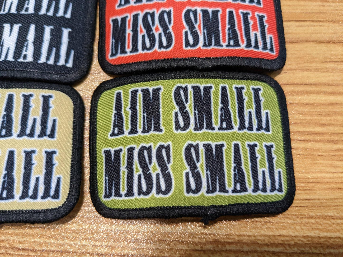 Aim Small Miss Small Patriot quote 2"x3" removable morale patch with hook and loop backing