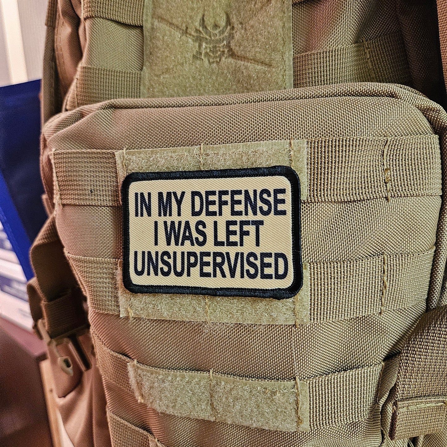 Tan In My Defense I was left Unsupervised removable patch 2"x3" morale patch with hook and loop backing