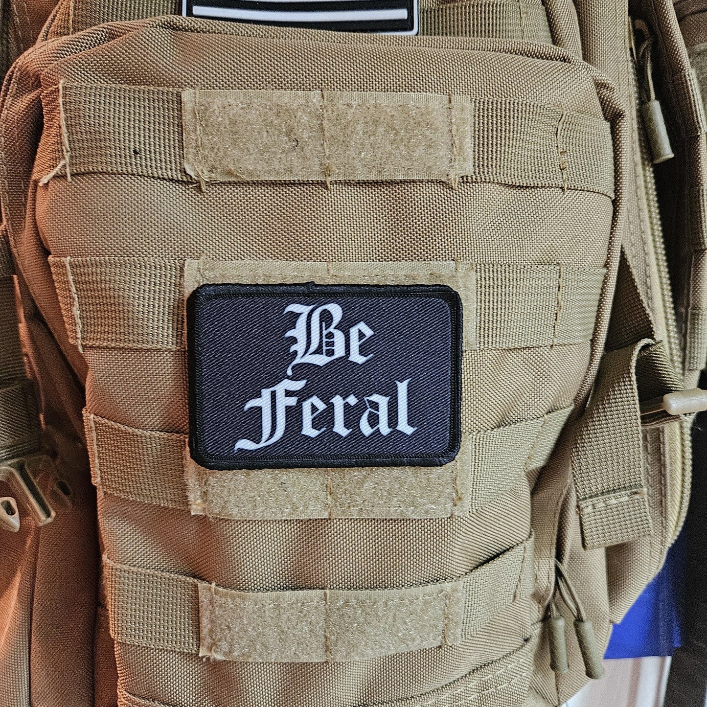 Black and white "be feral" girls and boys meme 2"x3" morale patch with hook and loop backing