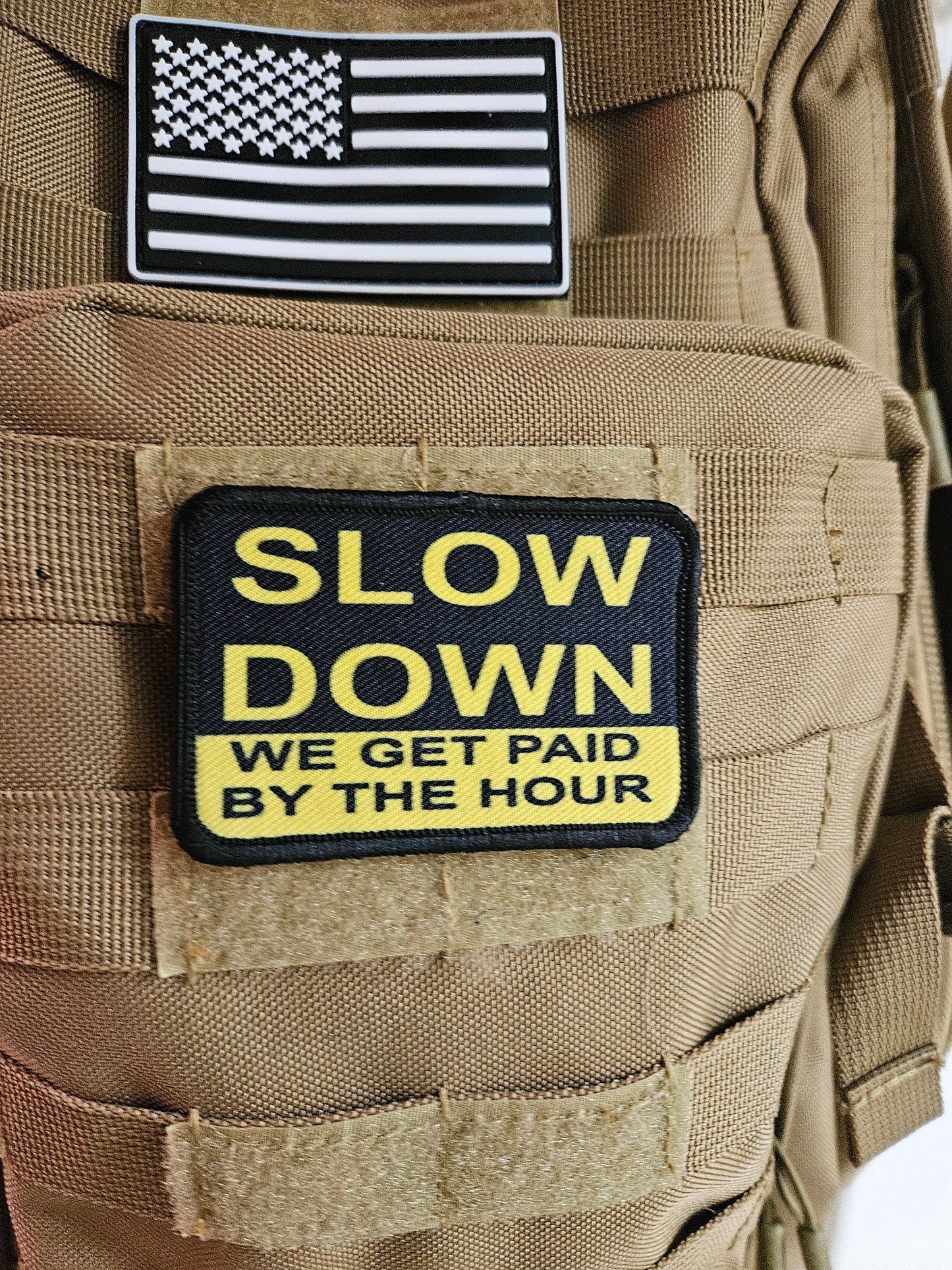 Slow down we get paid by the hour 2"x3" morale patch with hook and loop backing blue collar