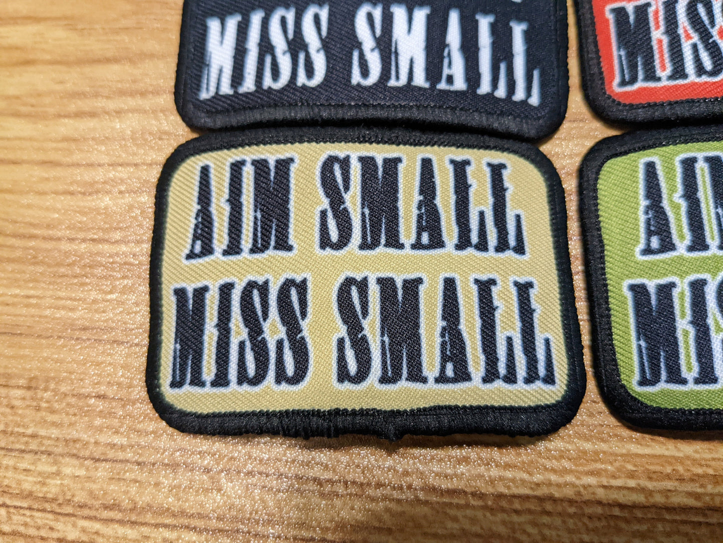 Aim Small Miss Small Patriot quote 2"x3" removable morale patch with hook and loop backing