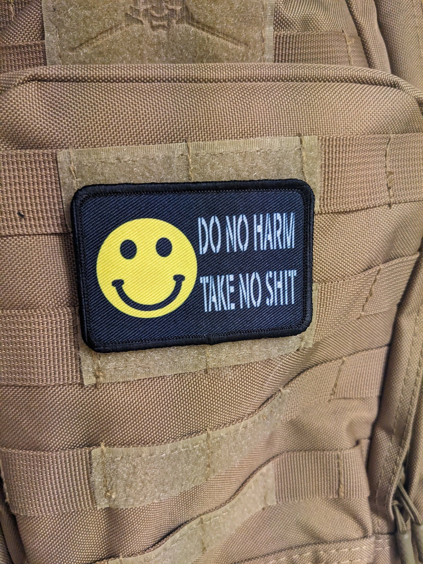 Do no harm take no shit smile meme 2"x3" morale patch with hook and loop backing