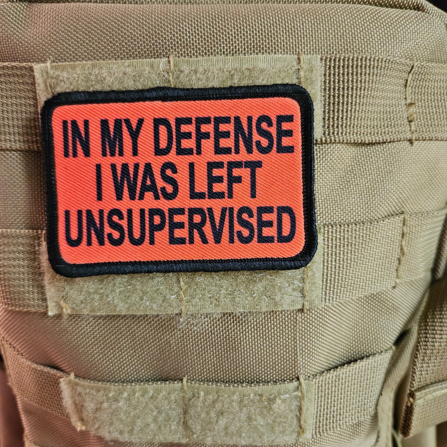 Red In My Defense I was left Unsupervised removable patch 2"x3" morale patch with hook and loop backing