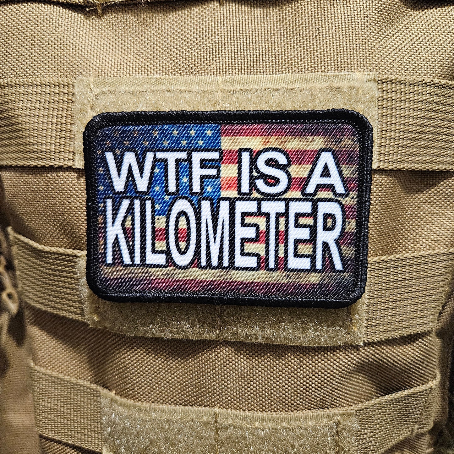 Wtf is a kilometer American flag 2"x3" morale patch with hook and loop backing