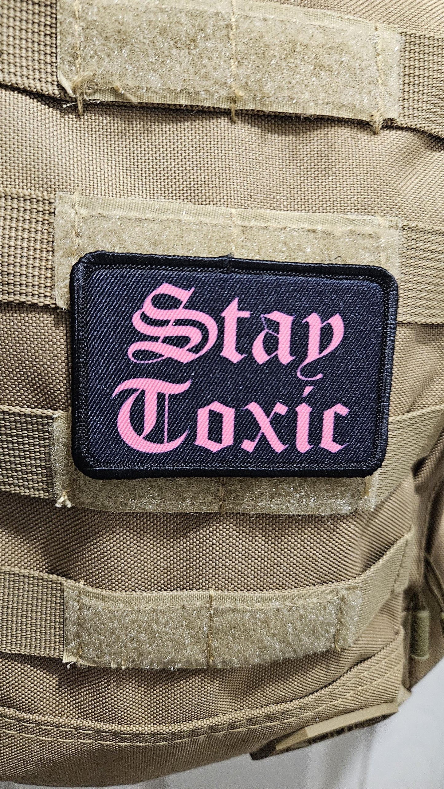 Stay toxic meme pink on black 2"x3" removable morale patch with hook and loop backing