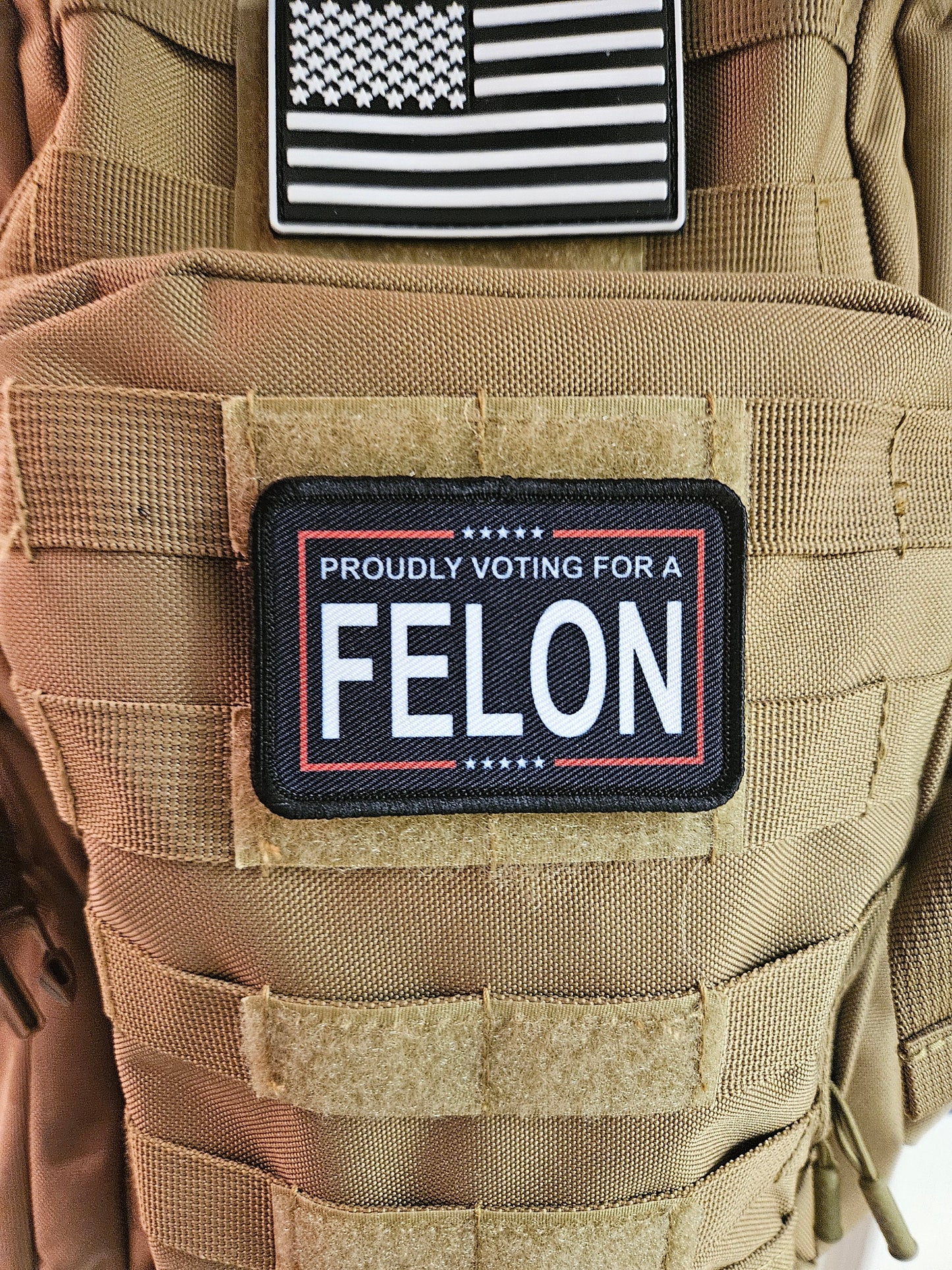 Proudly voting for a felon black 2"x3" removable morale patch with hook and loop backing meme