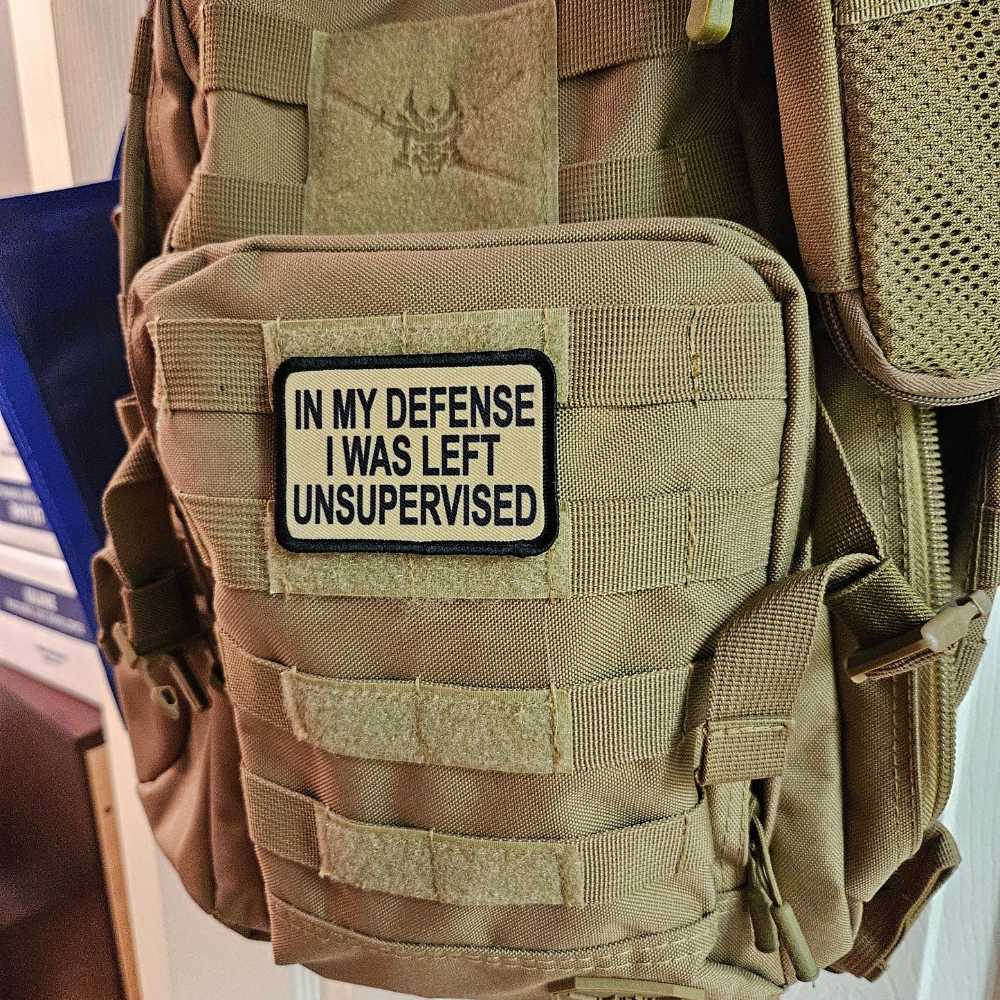 Tan In My Defense I was left Unsupervised removable patch 2"x3" morale patch with hook and loop backing