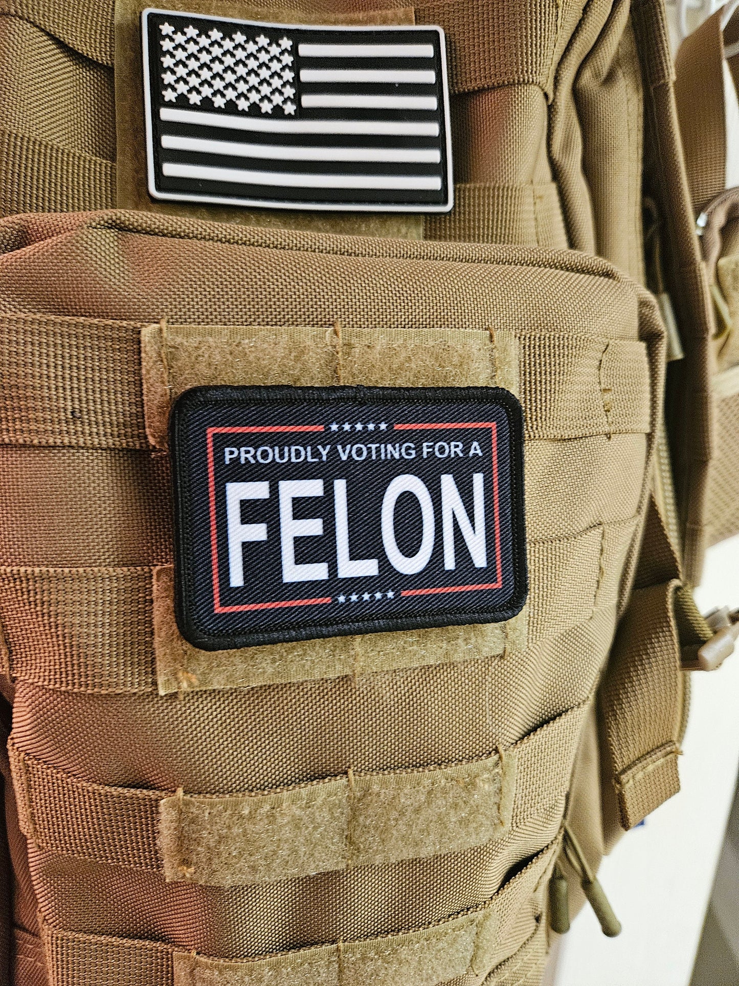 Proudly voting for a felon black 2"x3" removable morale patch with hook and loop backing meme