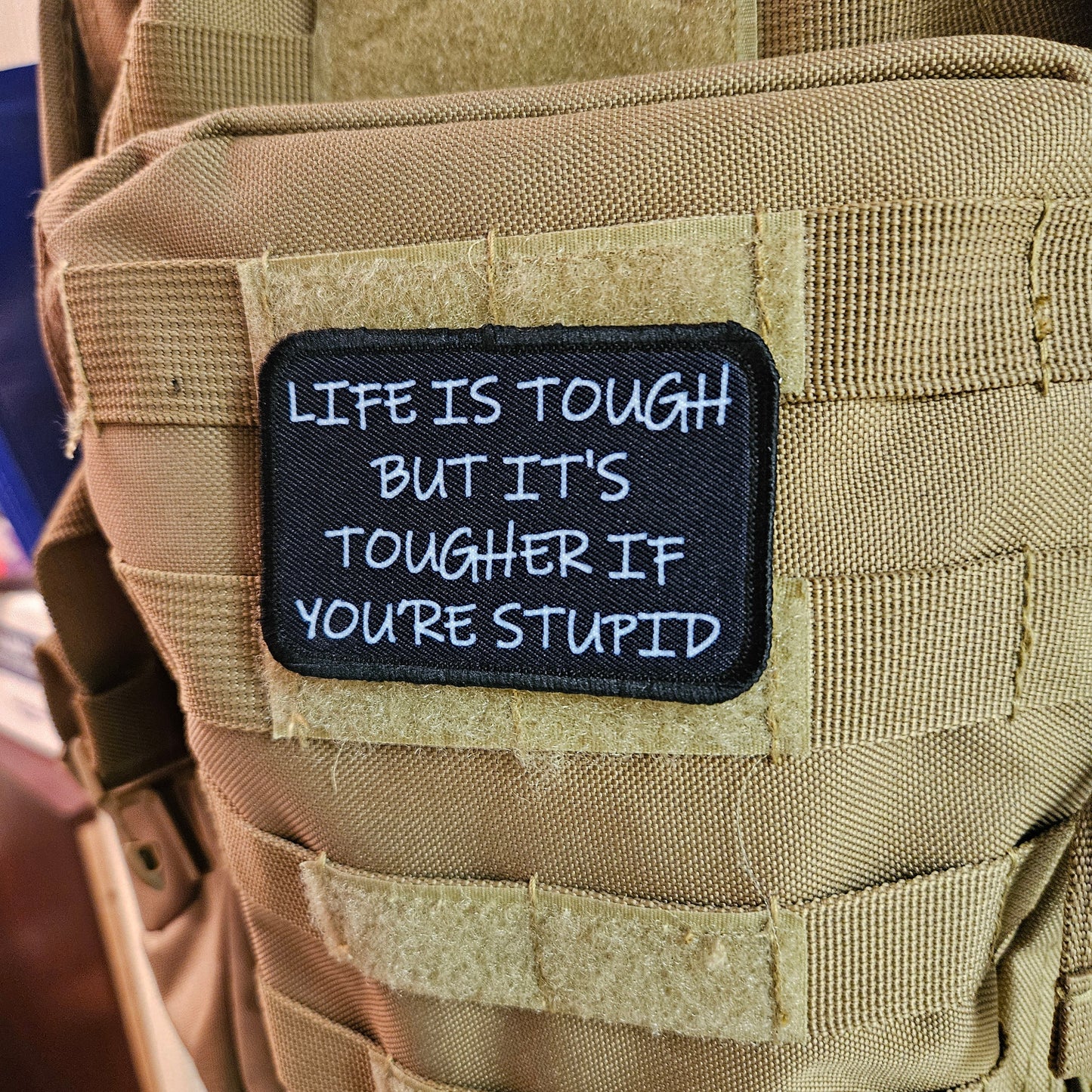Life is tough but it's tougher if you're stupid meme 2"x3" removable morale patch with hook and loop backing black and white