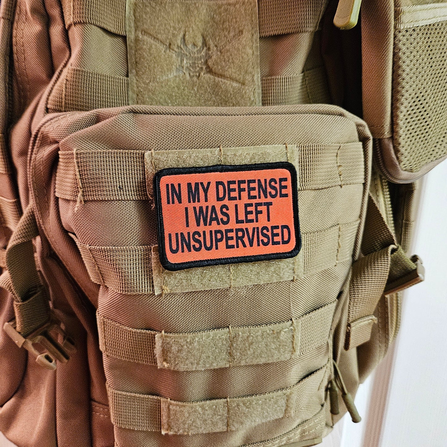 Red In My Defense I was left Unsupervised removable patch 2"x3" morale patch with hook and loop backing