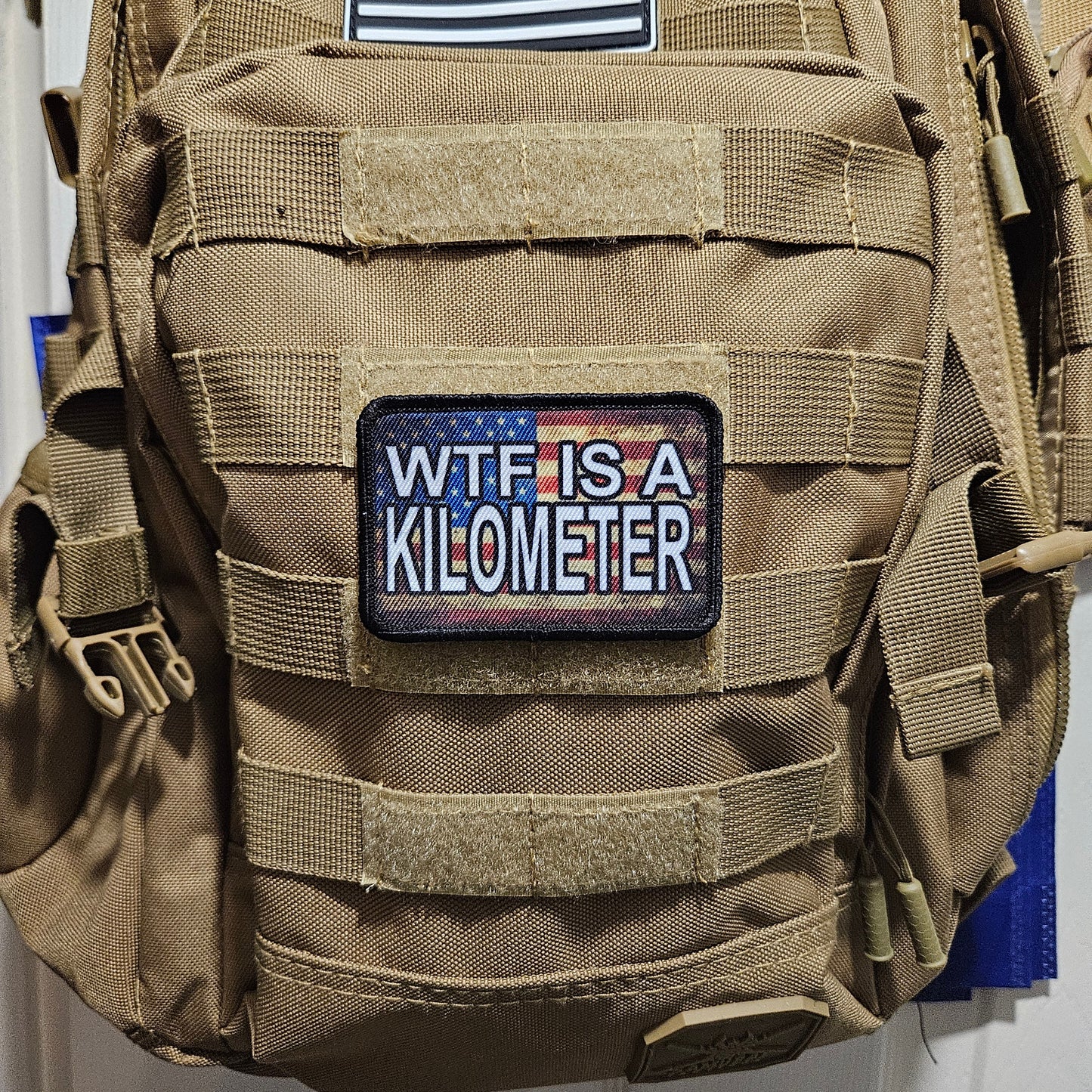 Wtf is a kilometer American flag 2"x3" morale patch with hook and loop backing