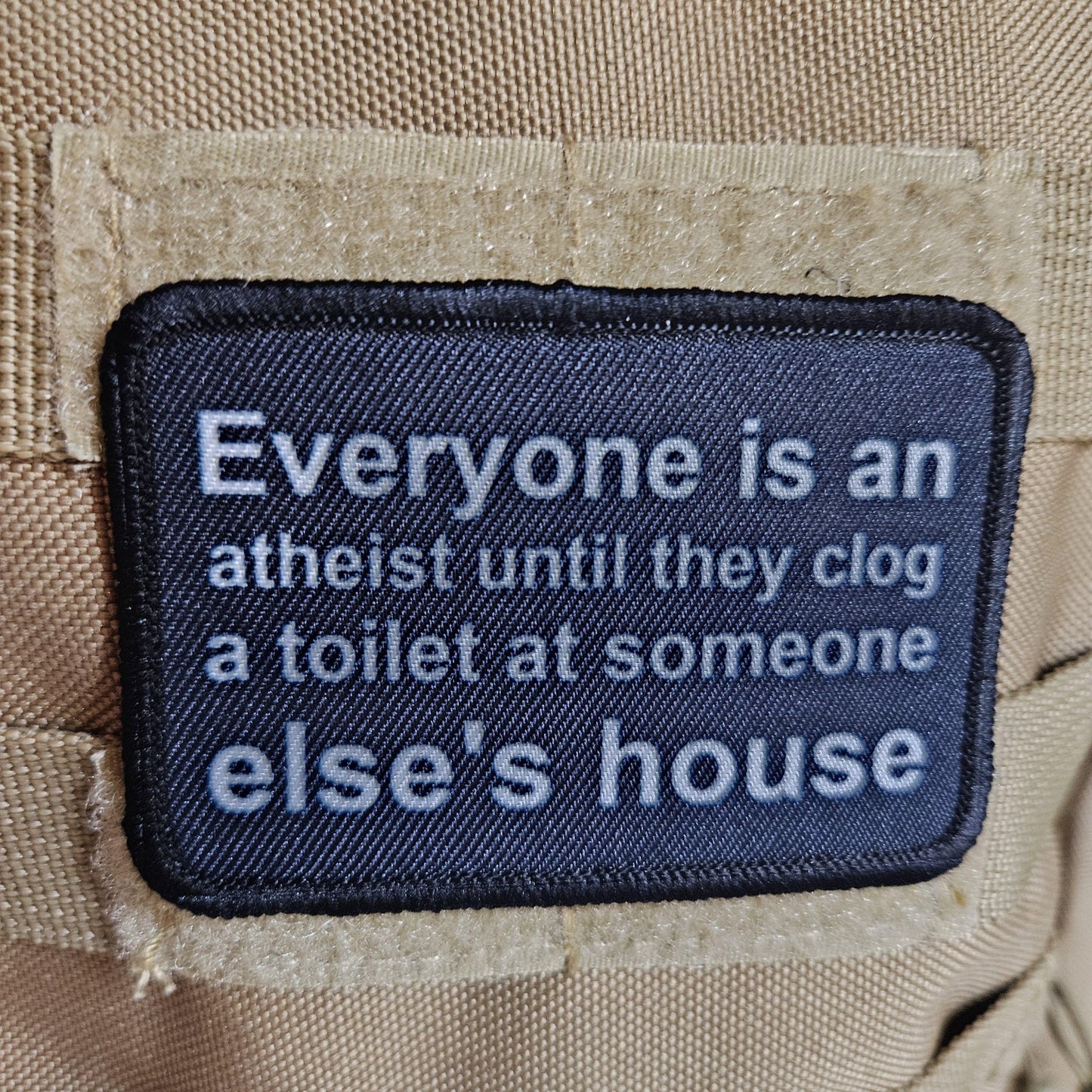 Everyone's an aetheist until they clog a toilet at somebody else's house 2"x3" removable morale patch with hook and loop backing
