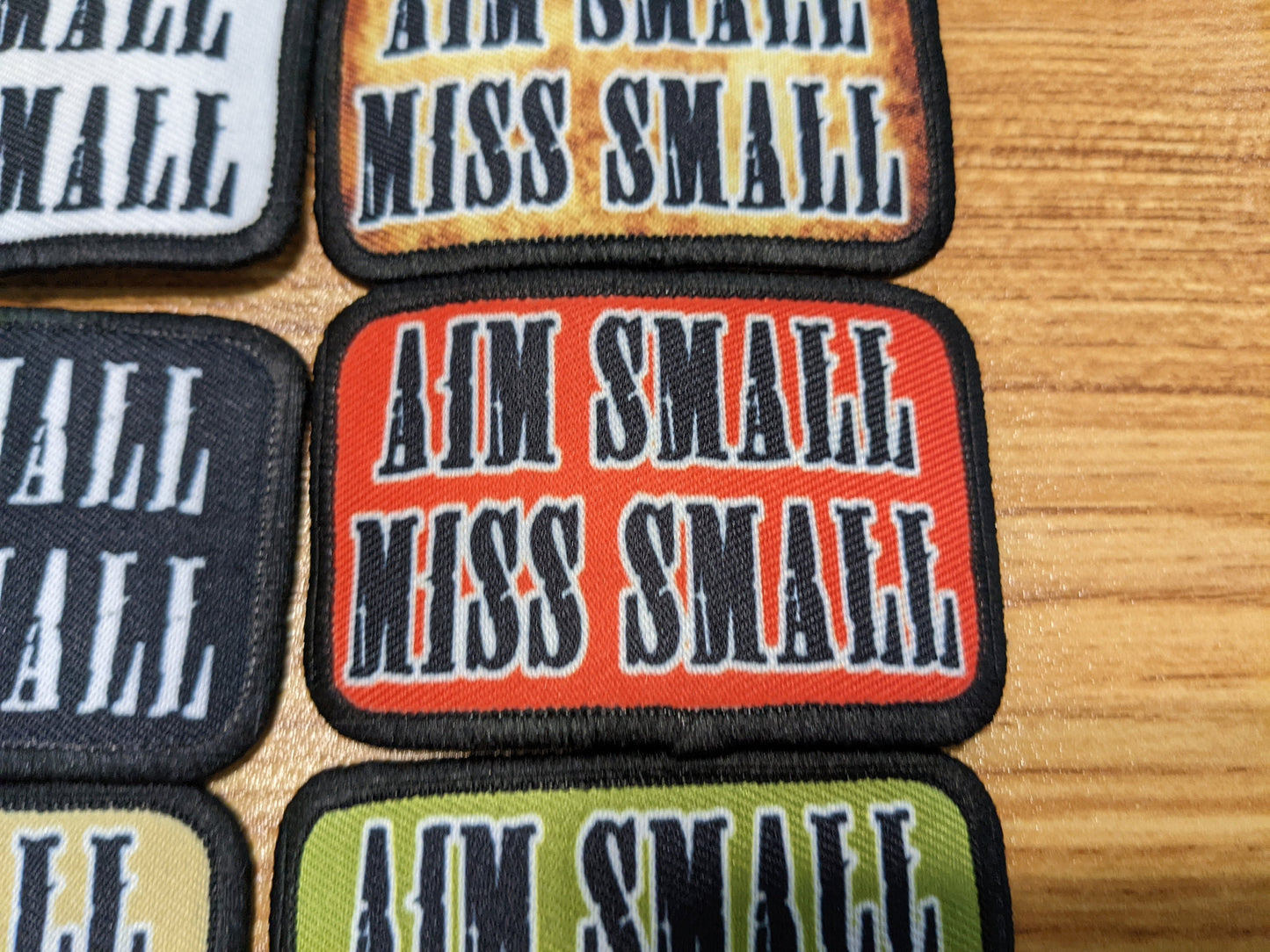 Aim Small Miss Small Patriot quote 2"x3" removable morale patch with hook and loop backing