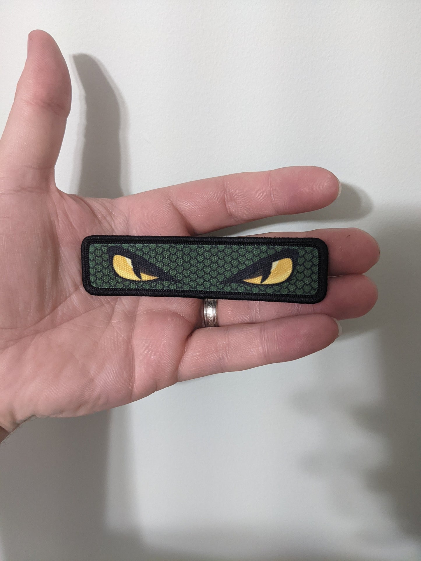 Snake eyes viper eyes 1"x4" removable morale patch with hook and loop backing good for back of operator hats