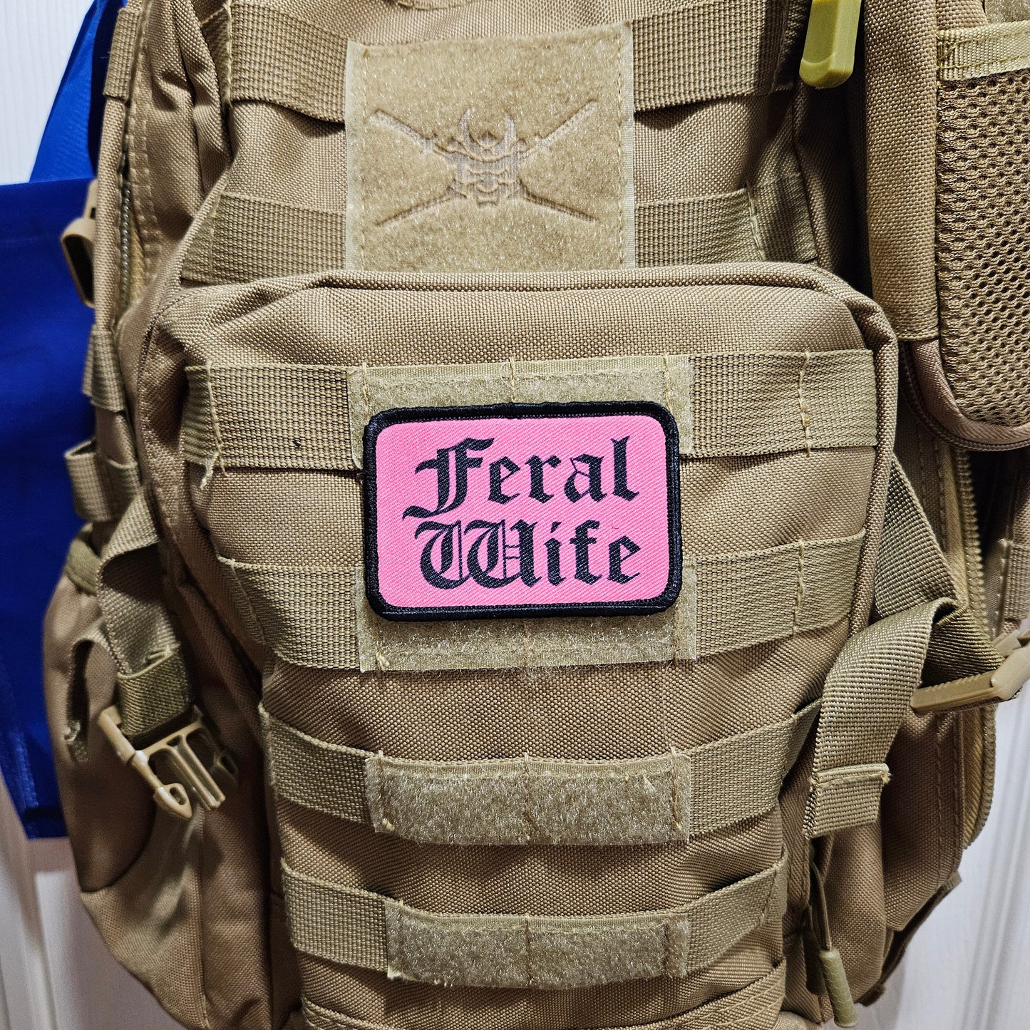 Feral wife meme 2"x3" morale patch with hook and loop backing black on pink