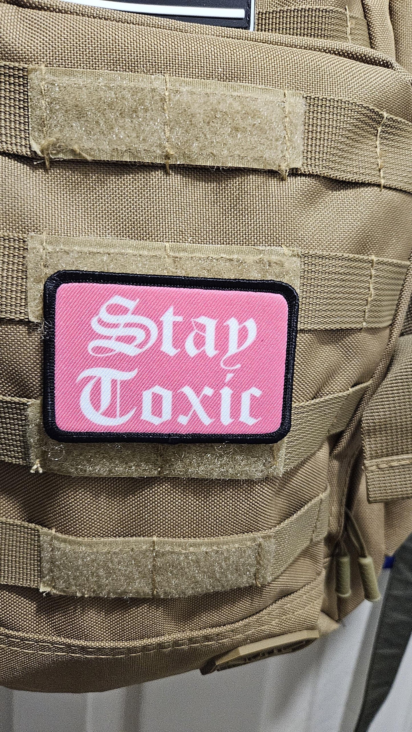 Stay toxic meme pink and white 2"x3" removable morale patch with hook and loop backing