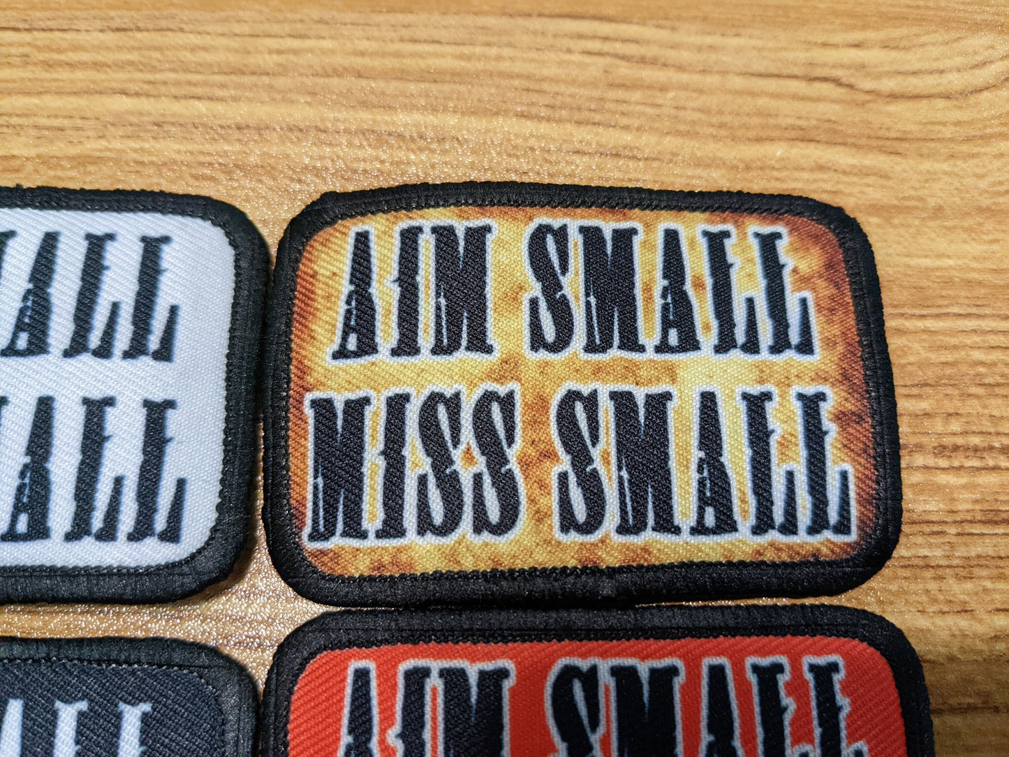 Aim Small Miss Small Patriot quote 2"x3" removable morale patch with hook and loop backing