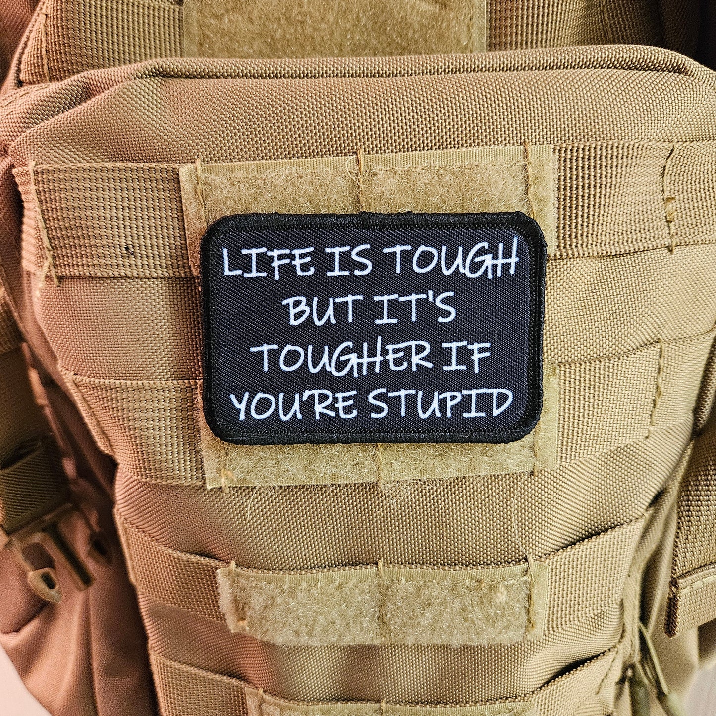 Life is tough but it's tougher if you're stupid meme 2"x3" removable morale patch with hook and loop backing black and white
