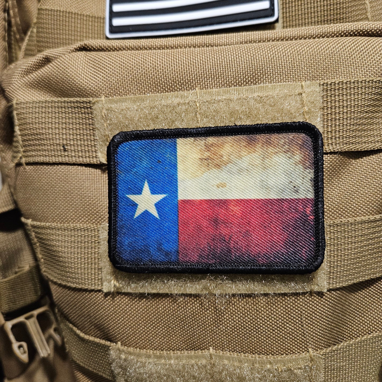 Distressed texas flag 2"x3" morale patch with hook and loop backing