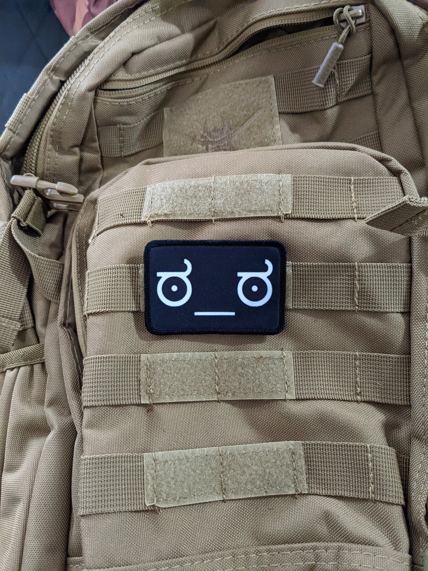Lenny face of disapproval face black background meme 2"x3" morale patch with hook and loop backing