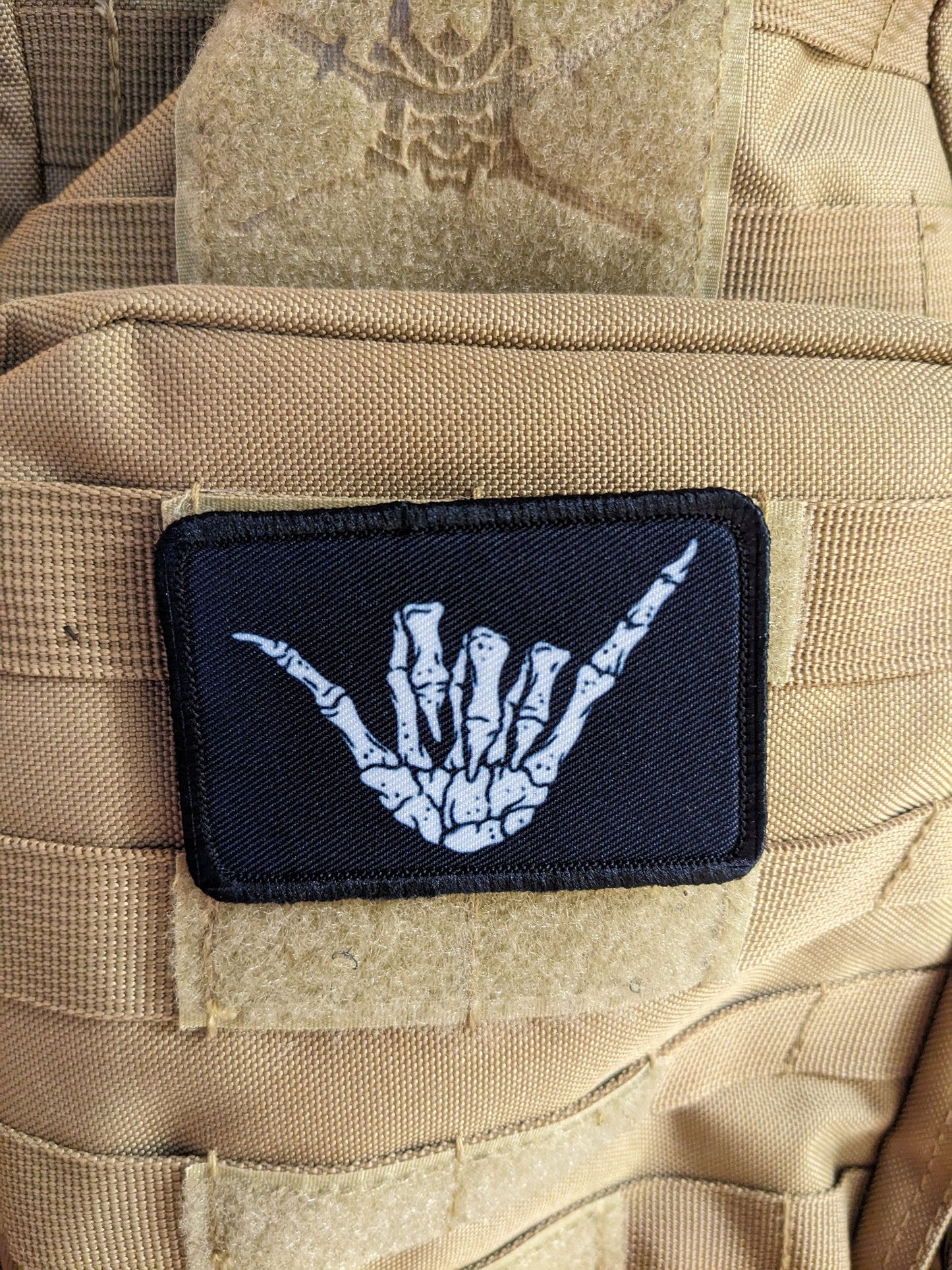 Bone shaka punk goth joke 2"x3" white morale patch with hook and loop backing