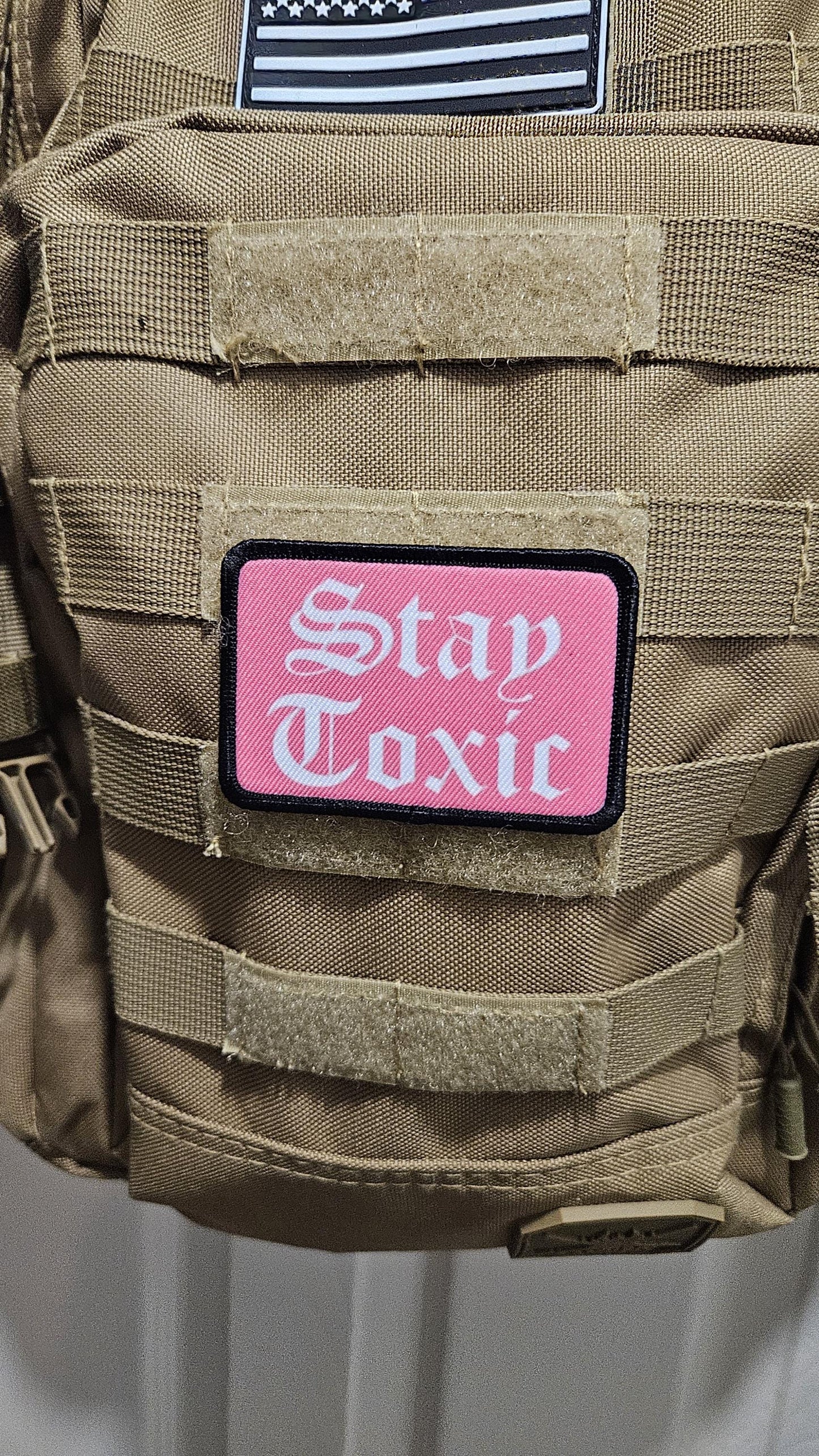 Stay toxic meme pink and white 2"x3" removable morale patch with hook and loop backing