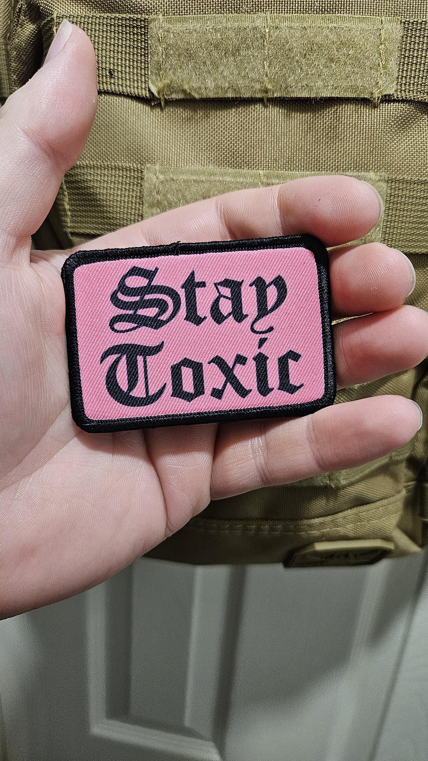 Stay toxic meme black on pink 2"x3" removable morale patch with hook and loop backing