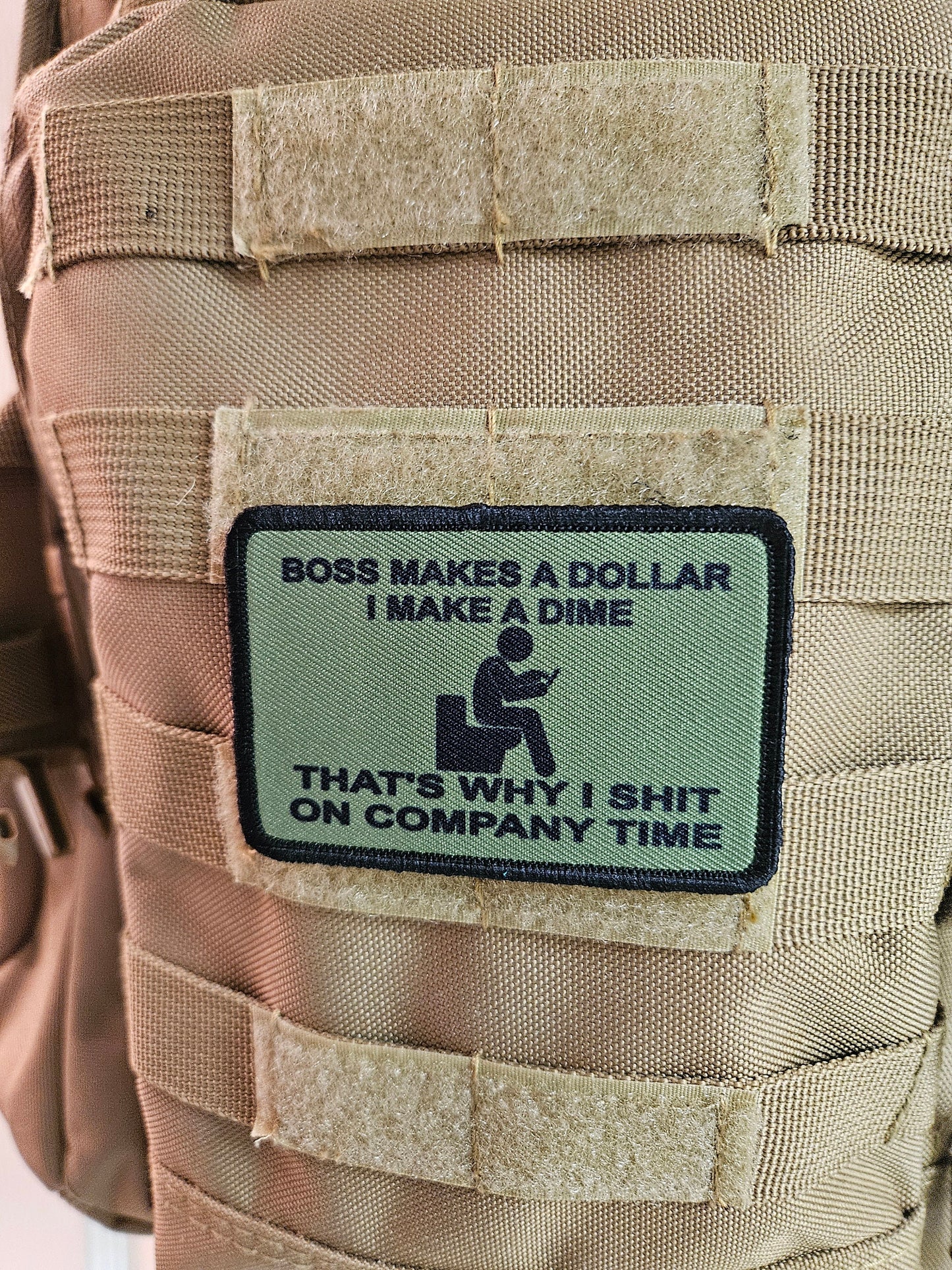 Boss makes a dollar I make a dime that's why I shit on company time 2"x3" morale patch with hook and loop backing green