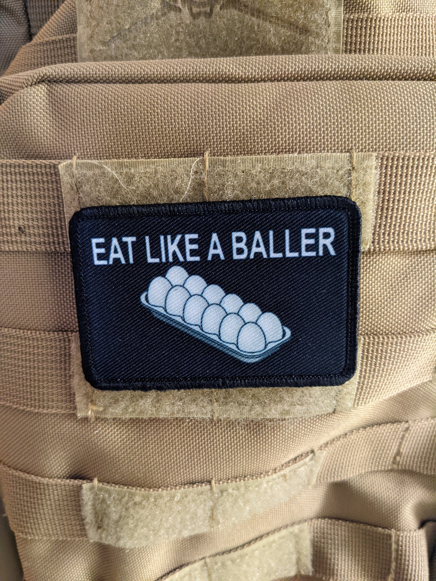 Eat like a baller egg shortage inflation meme 2"x3" removable morale patch with hook and loop backing