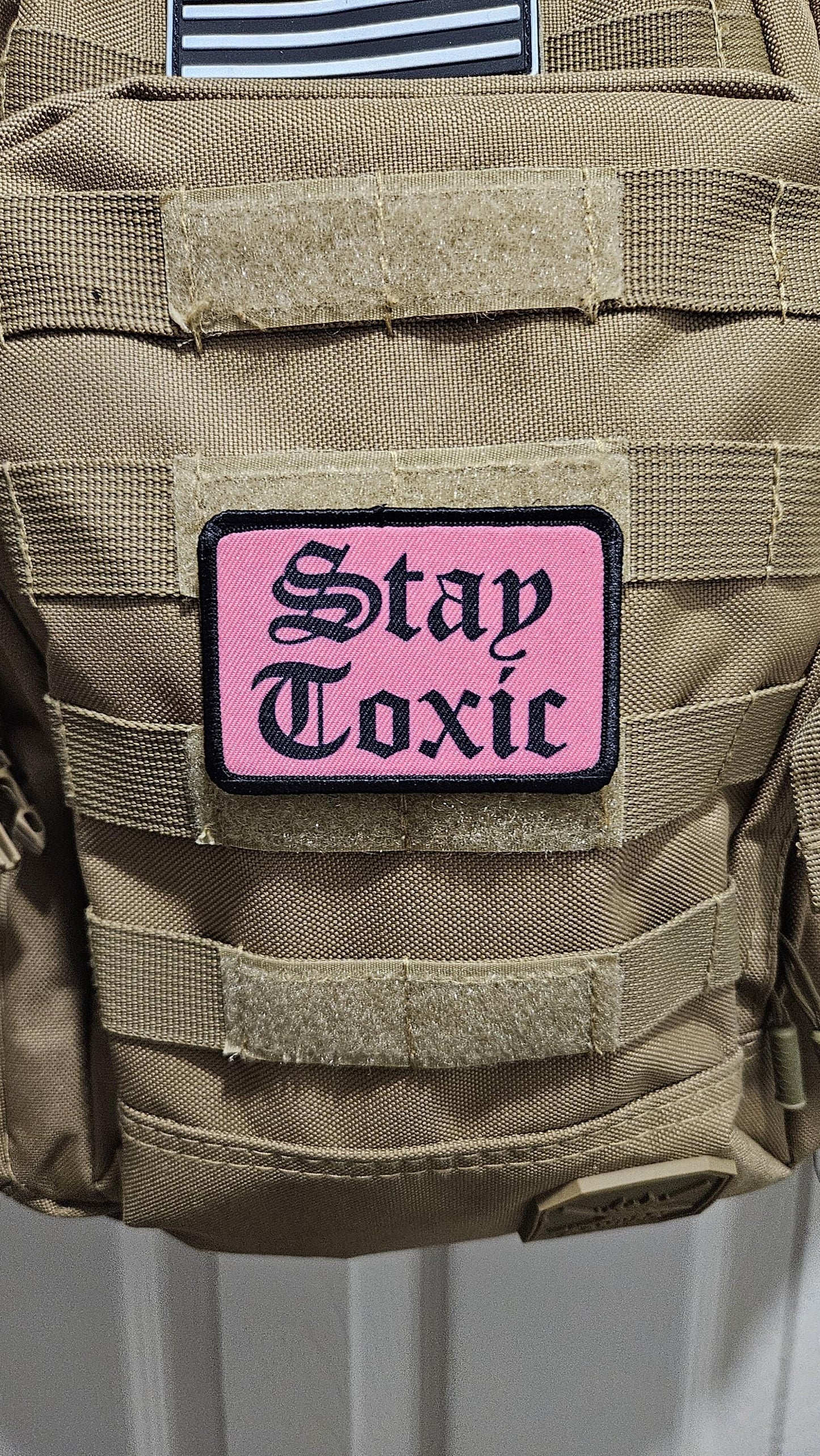 Stay toxic meme black on pink 2"x3" removable morale patch with hook and loop backing