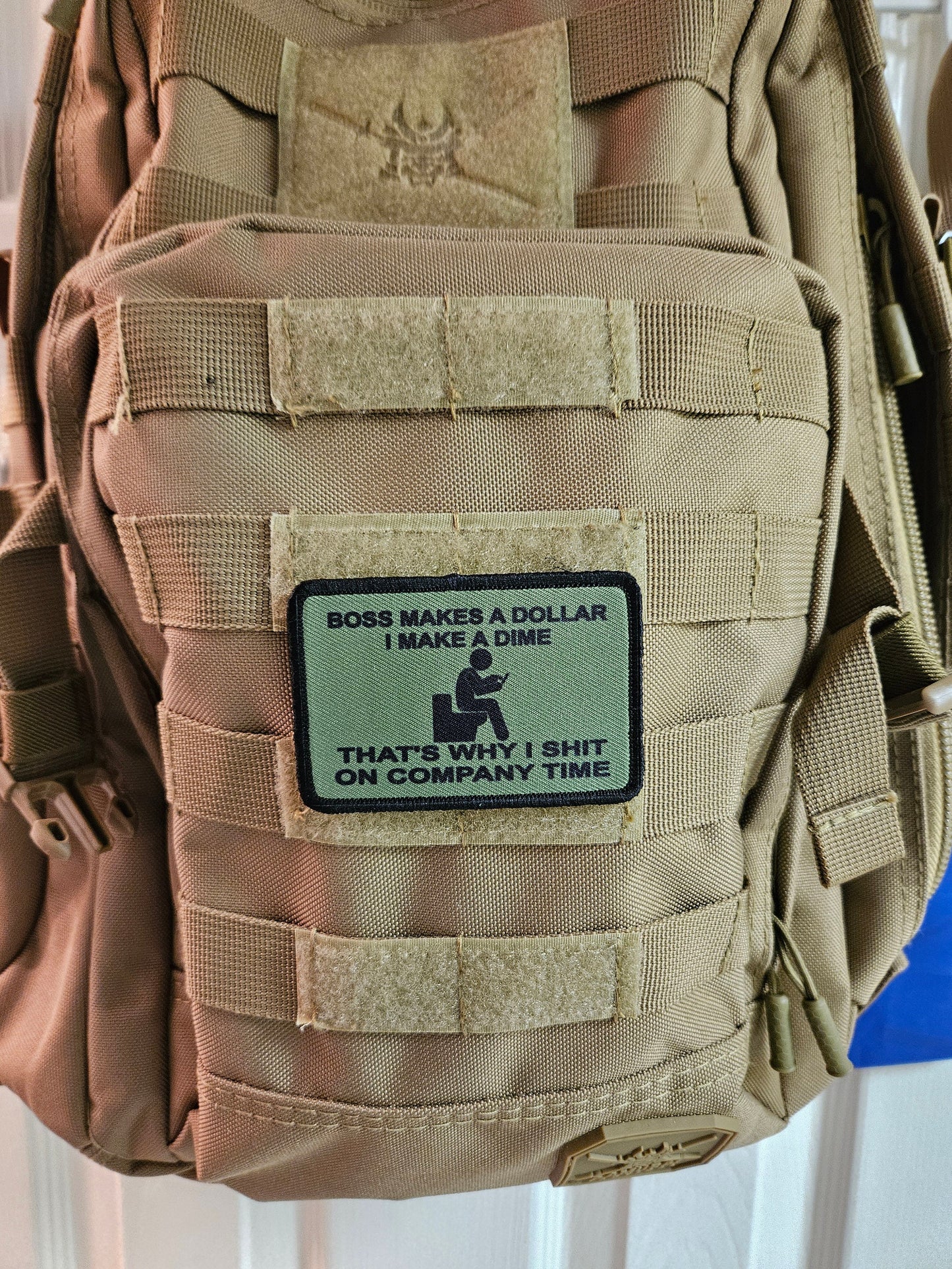 Boss makes a dollar I make a dime that's why I shit on company time 2"x3" morale patch with hook and loop backing green