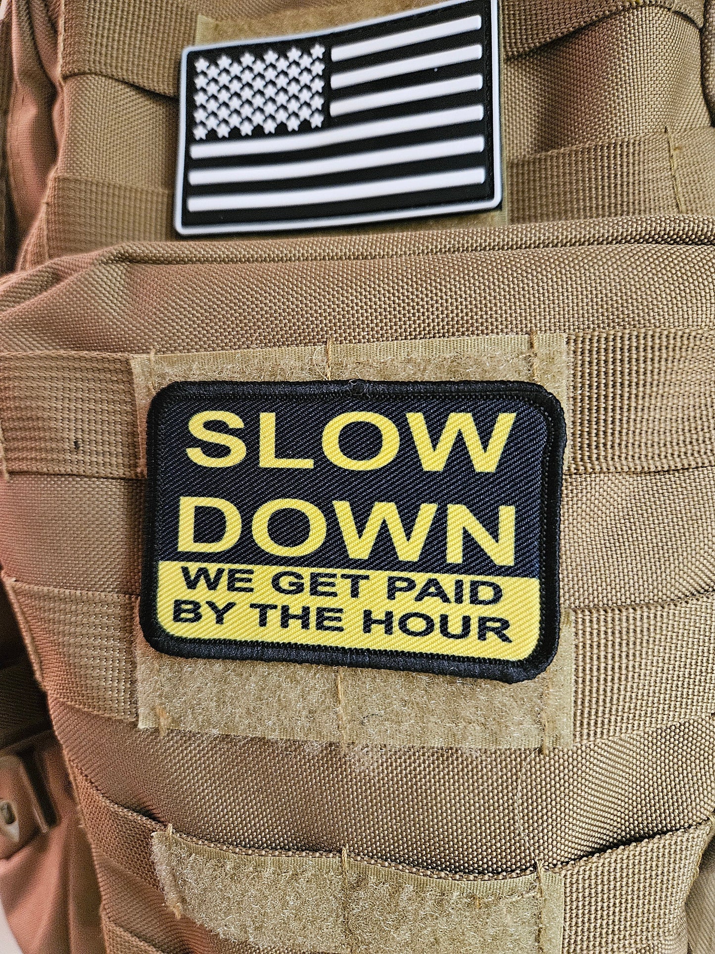 Slow down we get paid by the hour 2"x3" morale patch with hook and loop backing blue collar
