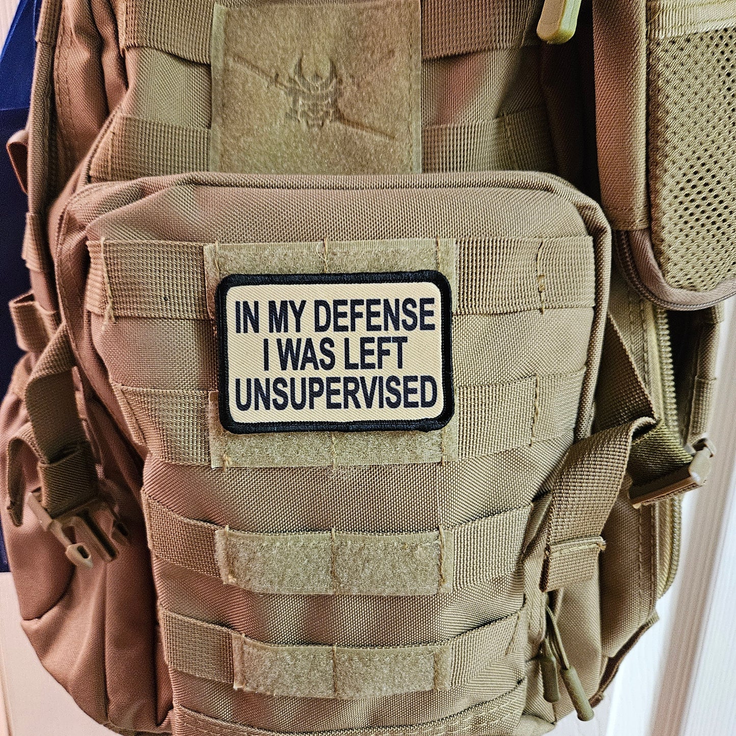 Tan In My Defense I was left Unsupervised removable patch 2"x3" morale patch with hook and loop backing