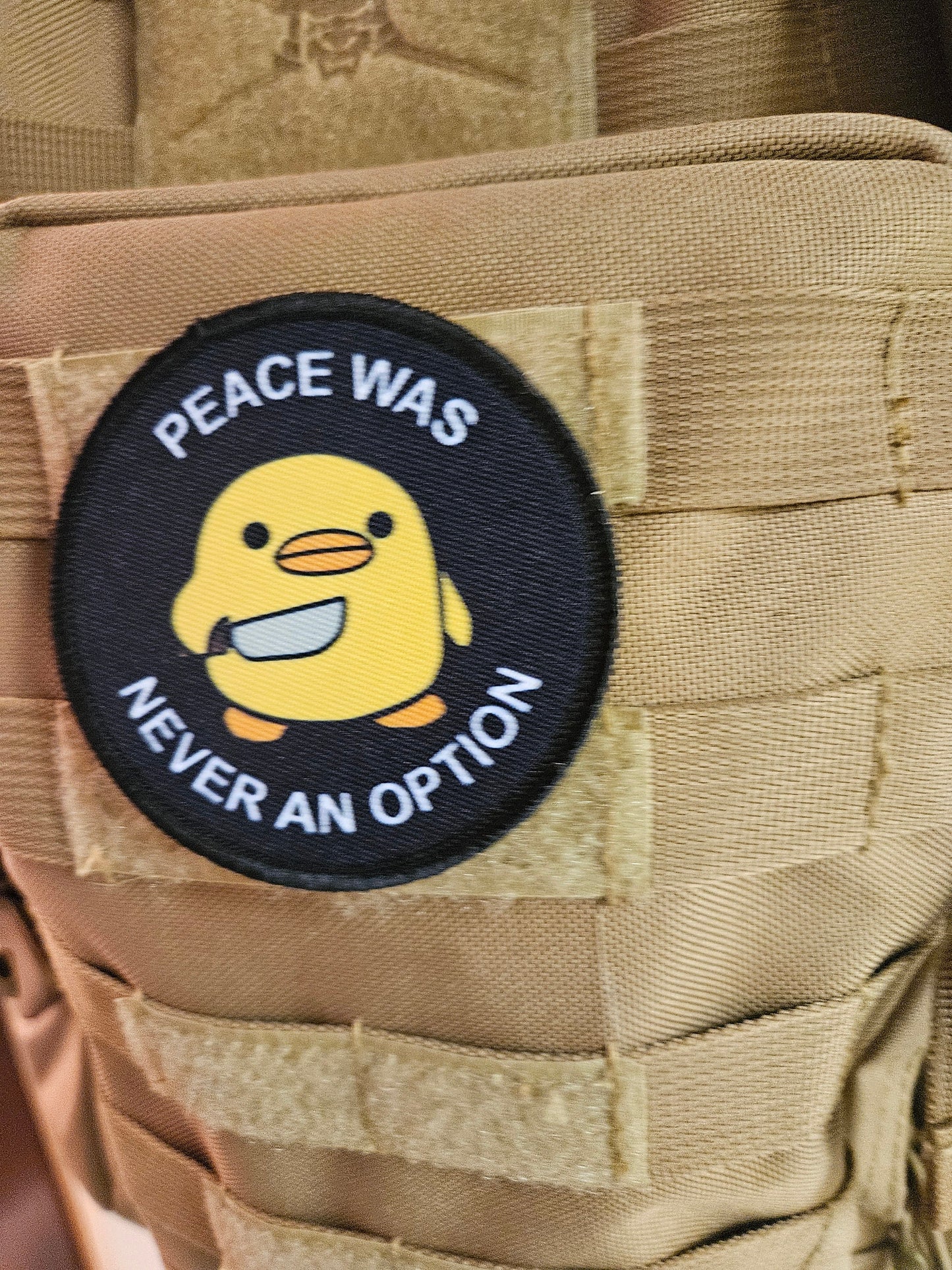 Peace was never an option duckling with knife meme 3" circle removable morale patch with hook and loop backing