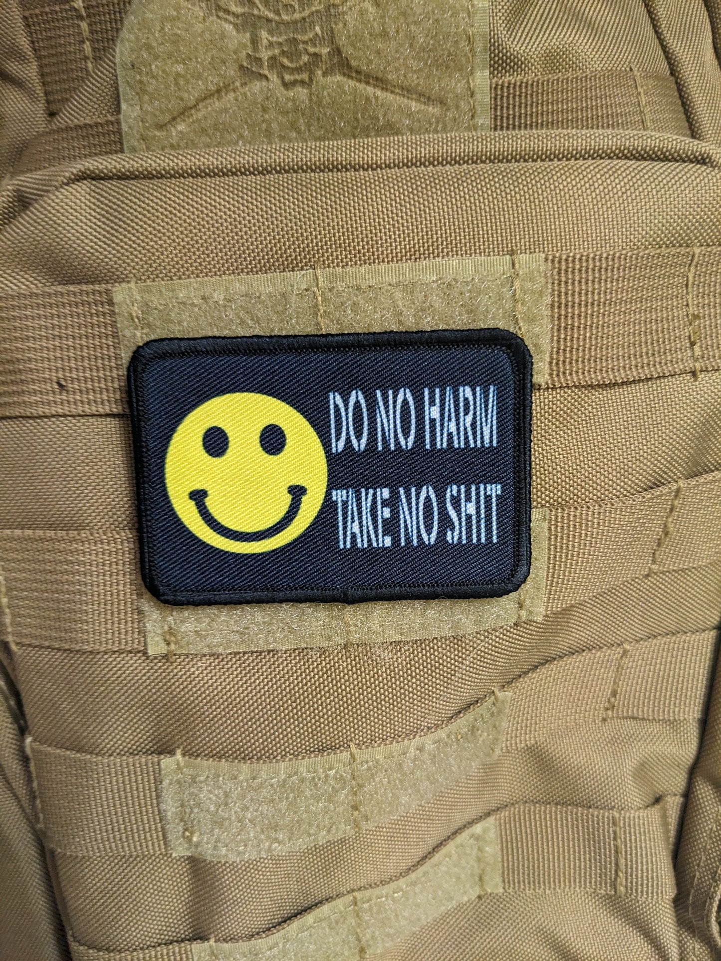Do no harm take no shit smile meme 2"x3" morale patch with hook and loop backing