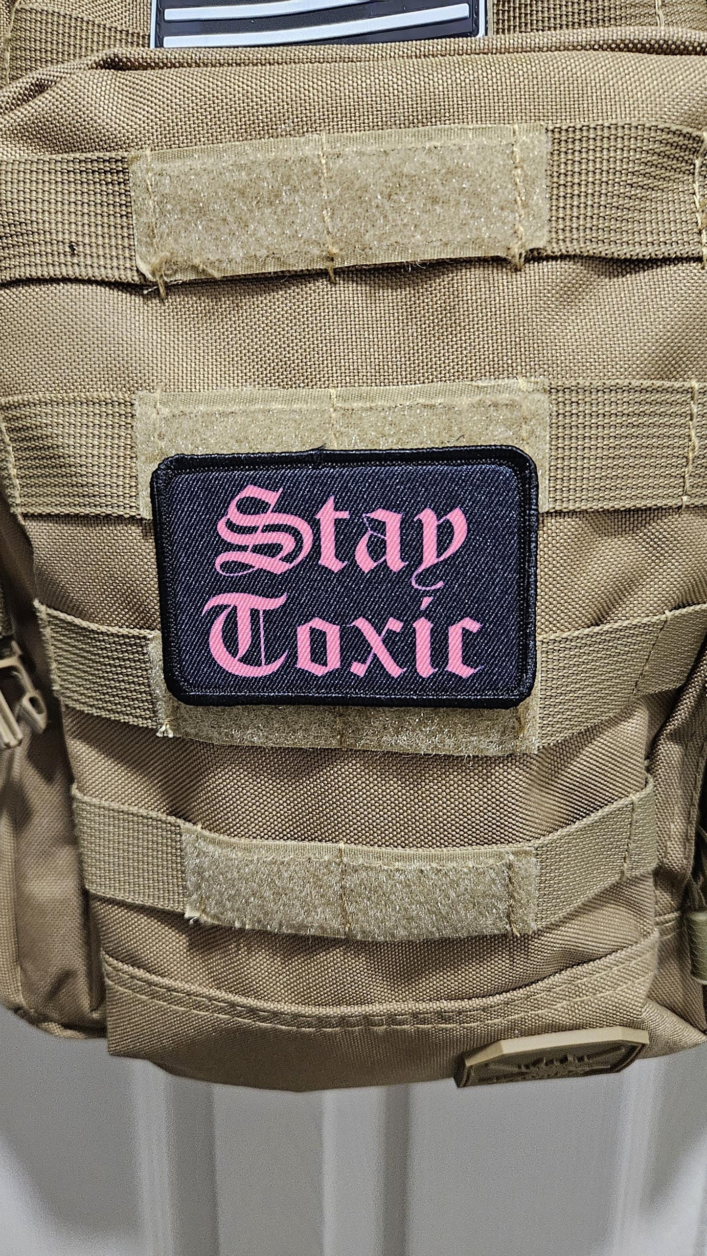 Stay toxic meme pink on black 2"x3" removable morale patch with hook and loop backing