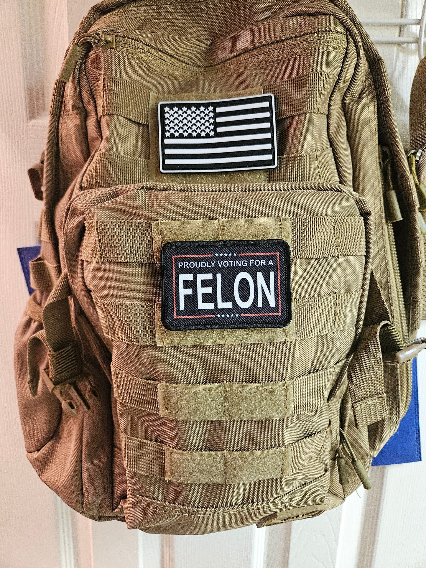 Proudly voting for a felon black 2"x3" removable morale patch with hook and loop backing meme