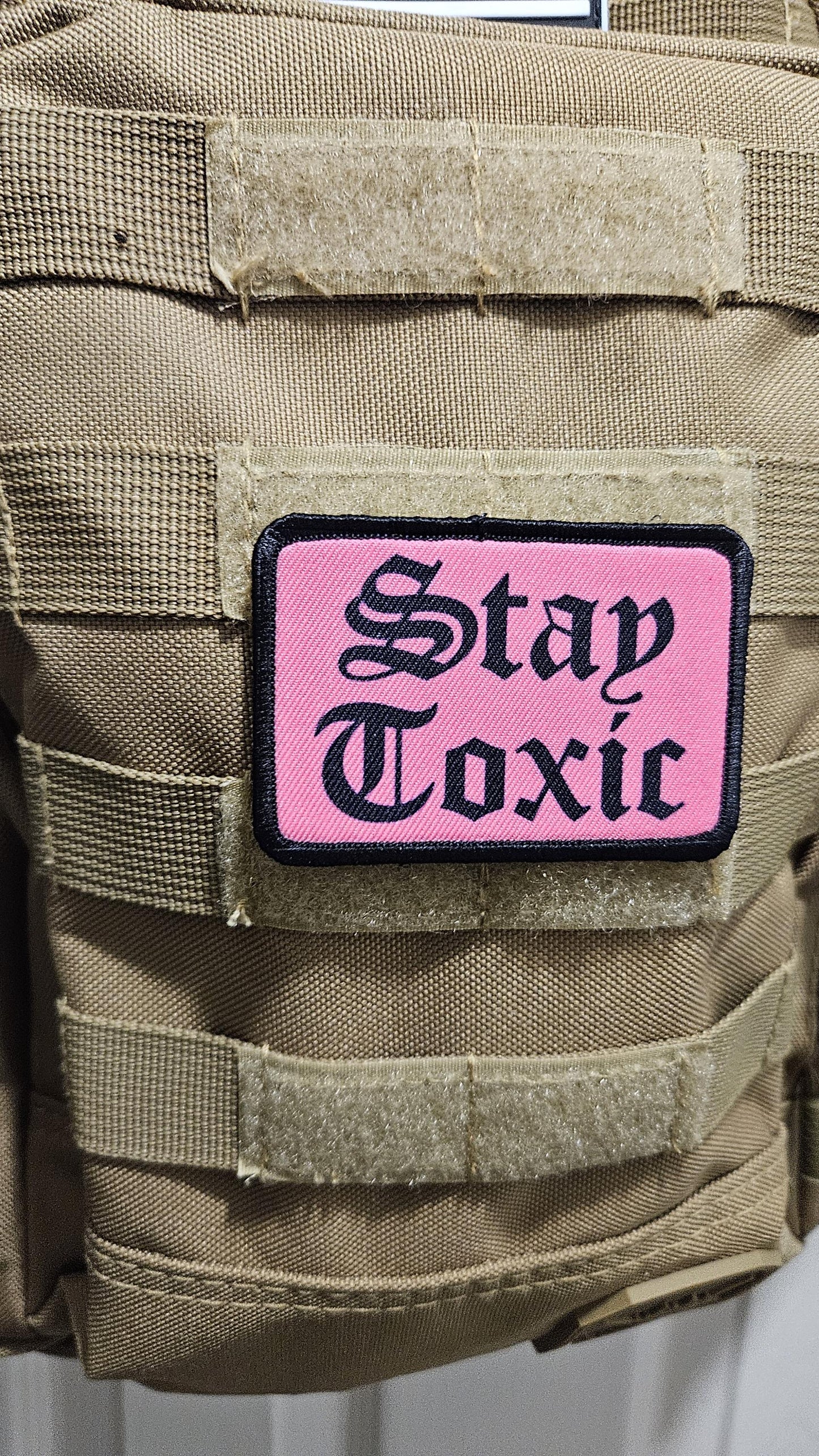 Stay toxic meme black on pink 2"x3" removable morale patch with hook and loop backing
