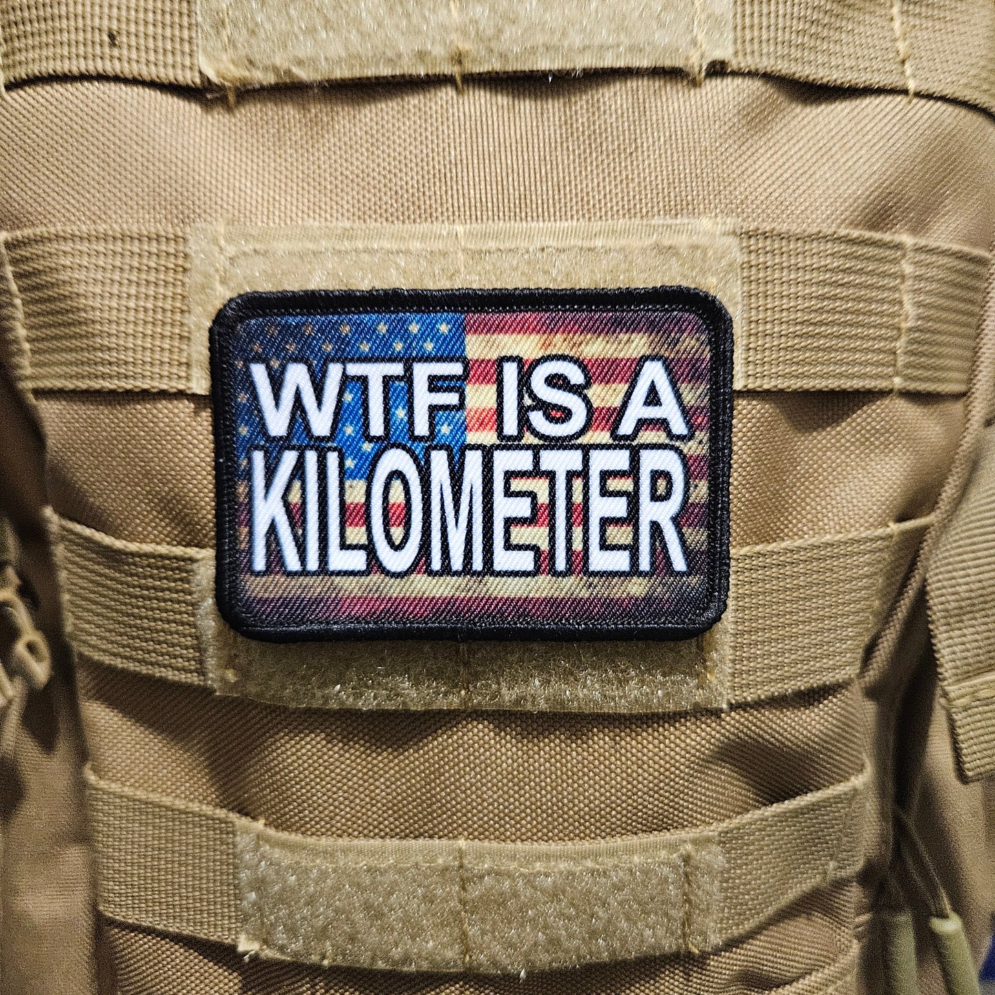 Wtf is a kilometer American flag 2"x3" morale patch with hook and loop backing