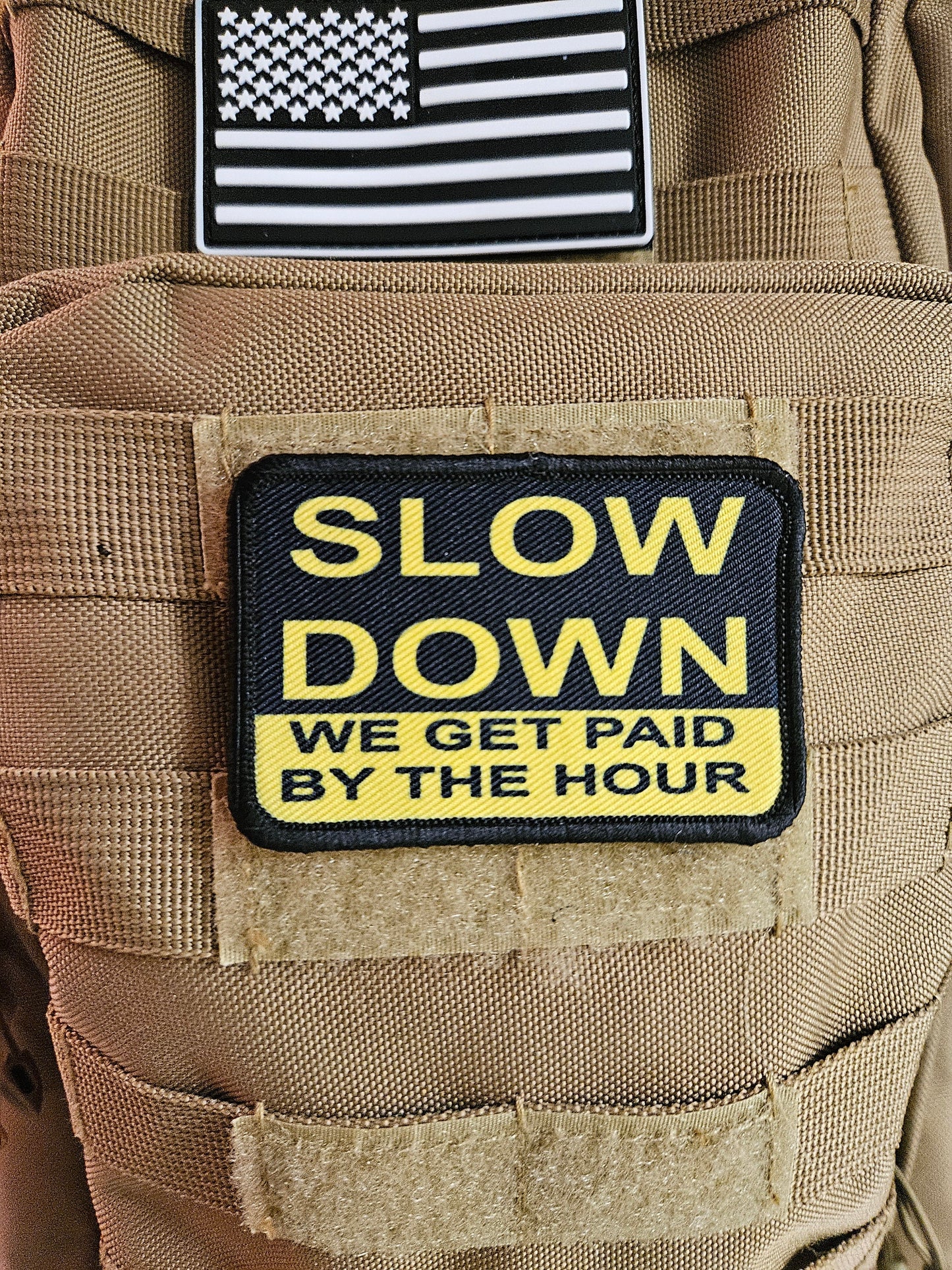 Slow down we get paid by the hour 2"x3" morale patch with hook and loop backing blue collar