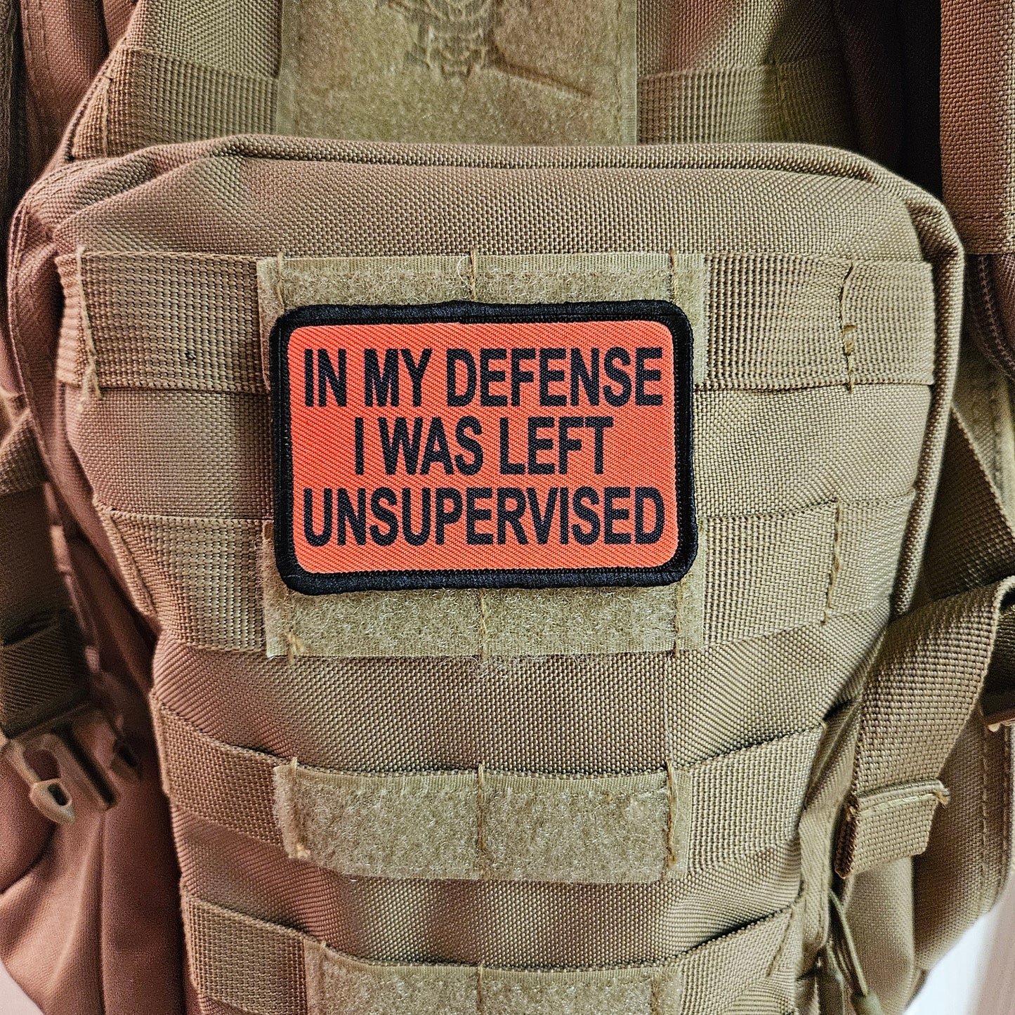 Red In My Defense I was left Unsupervised removable patch 2"x3" morale patch with hook and loop backing