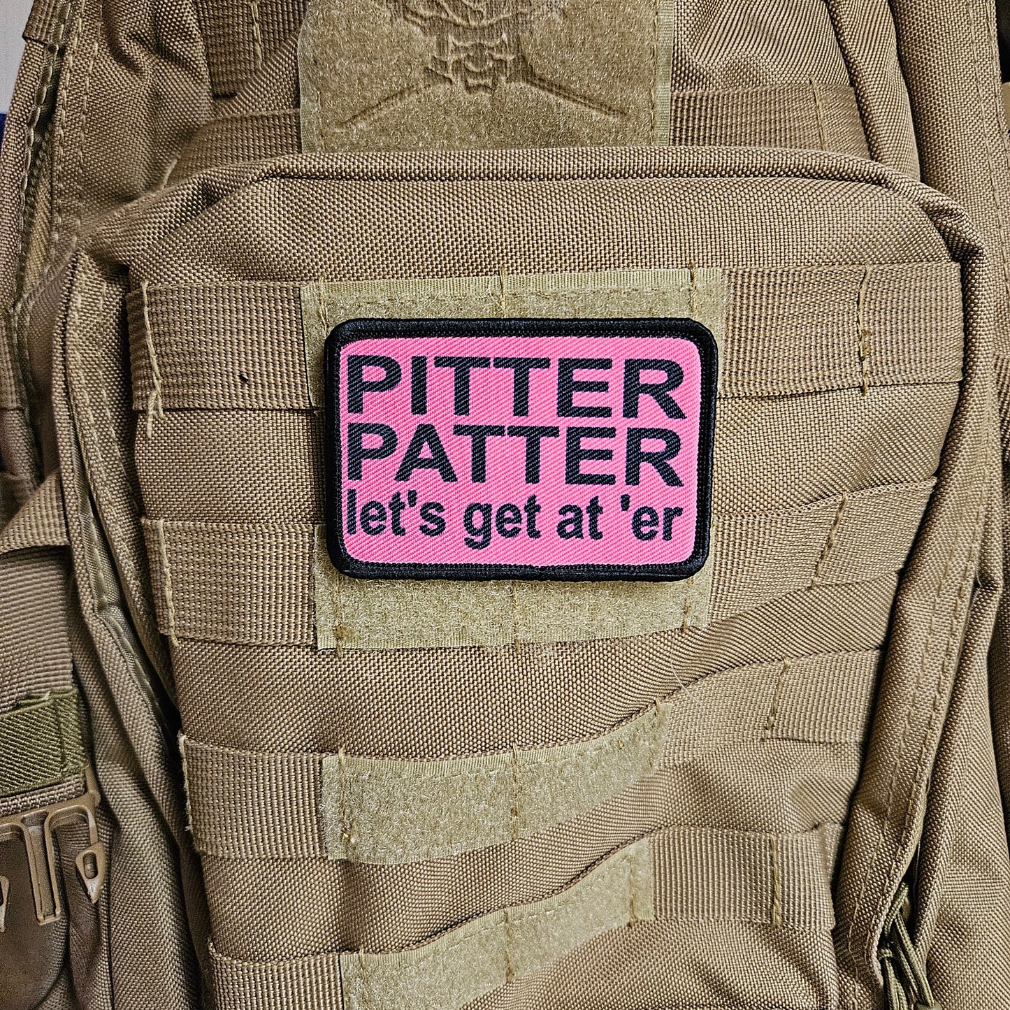 pink and black Pitter patter let's get at 'er meme 2"x3" removable morale patch with hook and loop backing