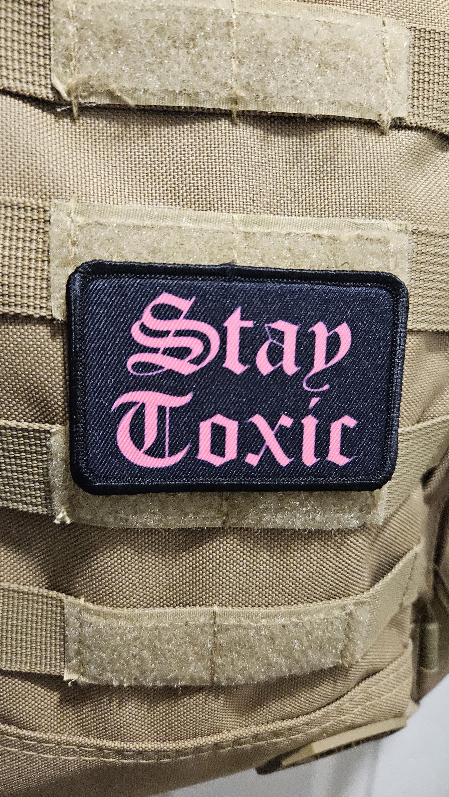 Stay toxic meme pink on black 2"x3" removable morale patch with hook and loop backing