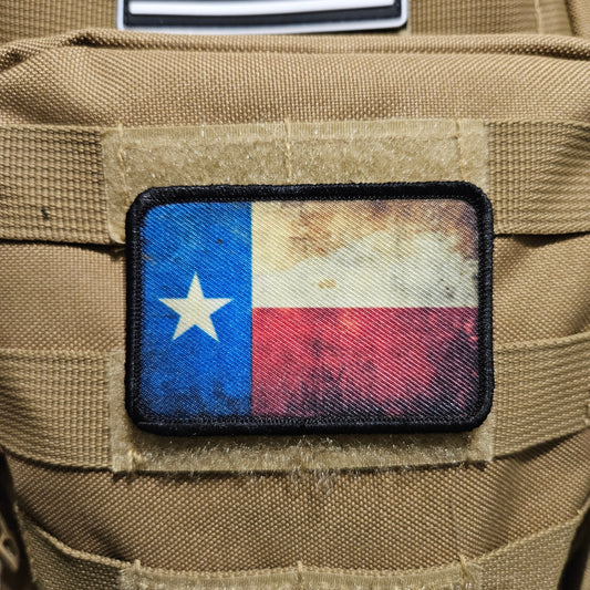Distressed texas flag 2"x3" morale patch with hook and loop backing
