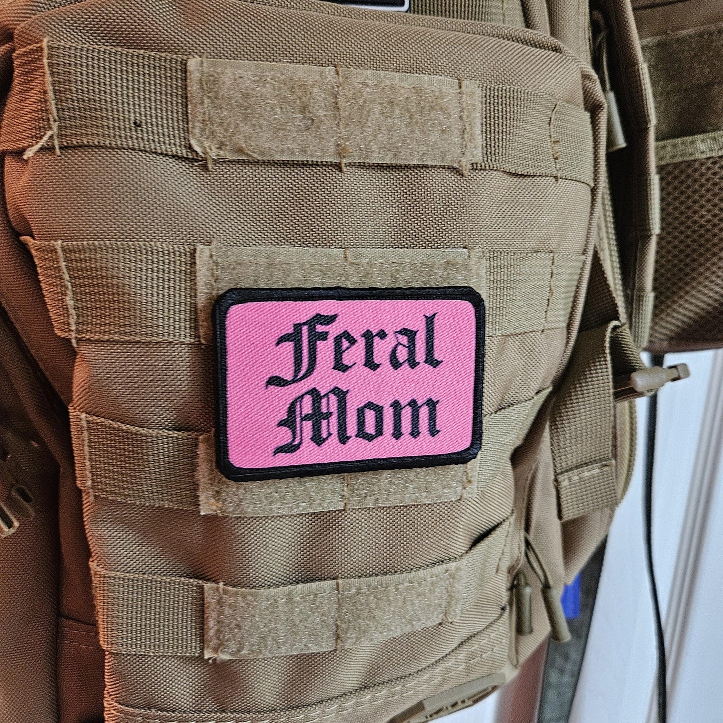 Pink "feral mom" girls and boys meme 2"x3" morale patch with hook and loop backing
