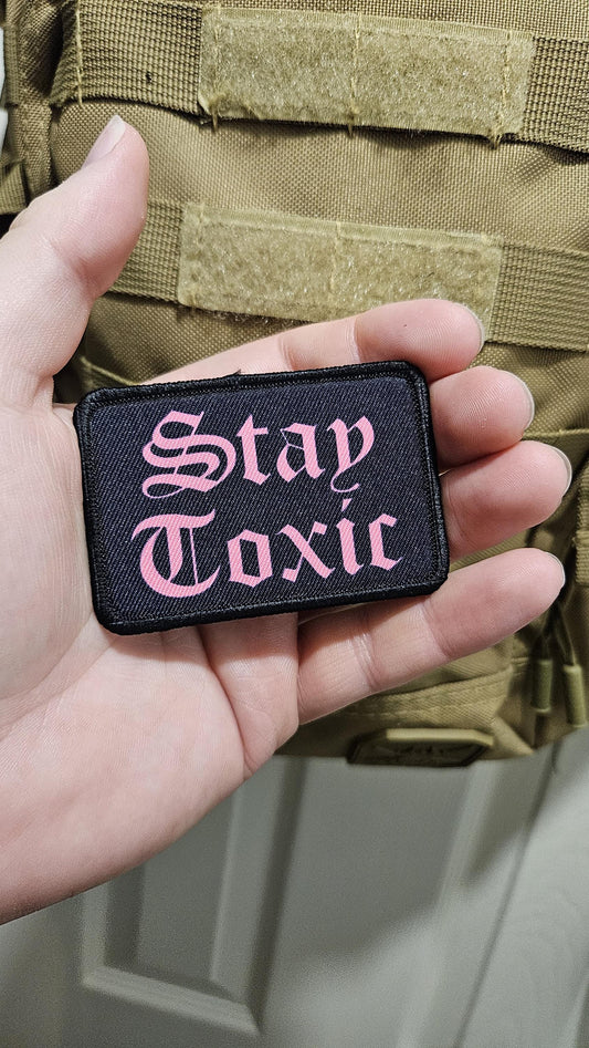 Stay toxic meme  pink on black 2"x3" removable morale patch with hook and loop backing