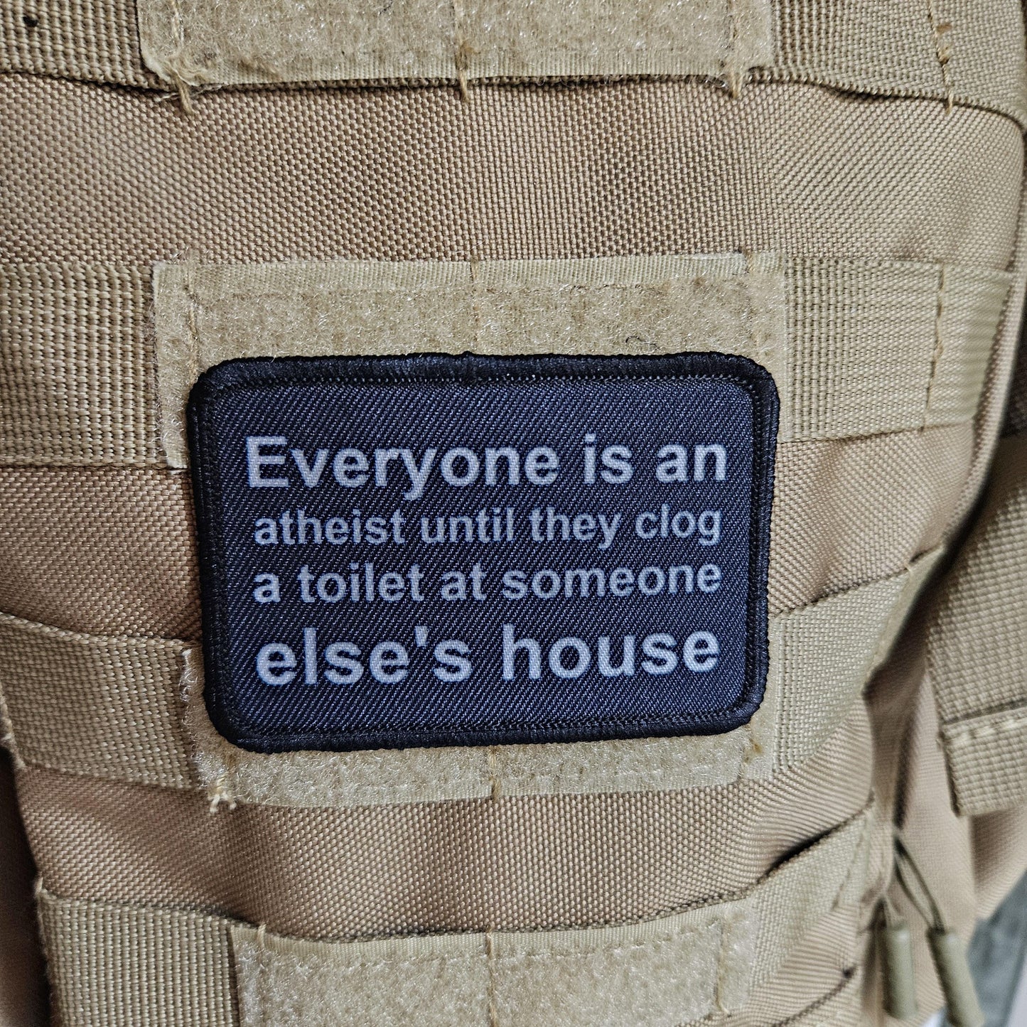Everyone's an aetheist until they clog a toilet at somebody else's house 2"x3" removable morale patch with hook and loop backing