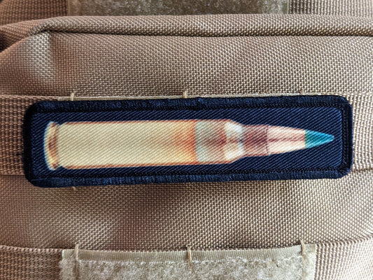 556 green tip round military 1"x4" removable morale patch with hook and loop backing good for back of operator hats